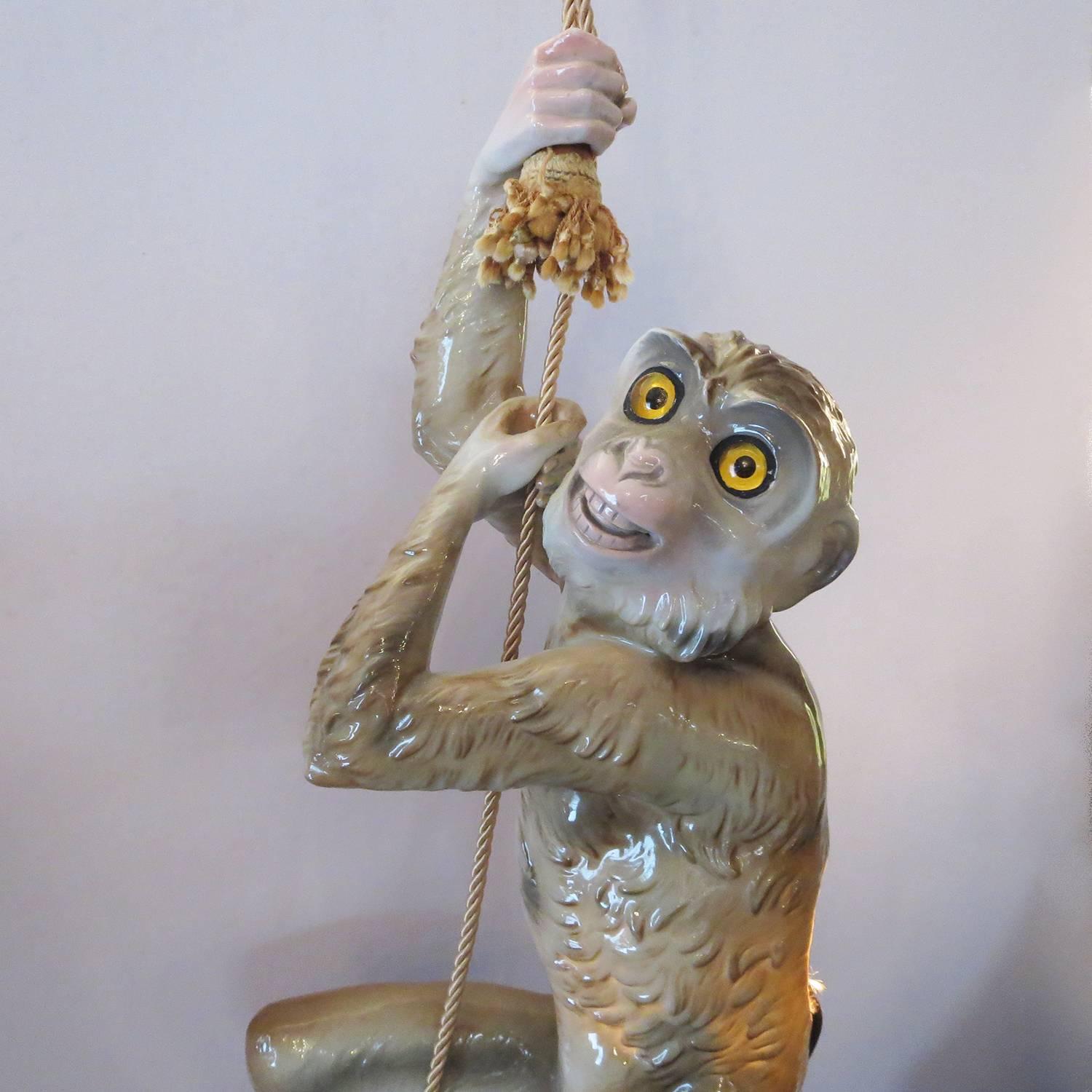 A wonderful and whimsical lamp by Italian ceramics giant Capodimonte. The monkey appears to be climbing the tasseled rope, when he is actually a lamp. There is new silk cord and socket, and the light works great. The glazed ceramic and glass eyes