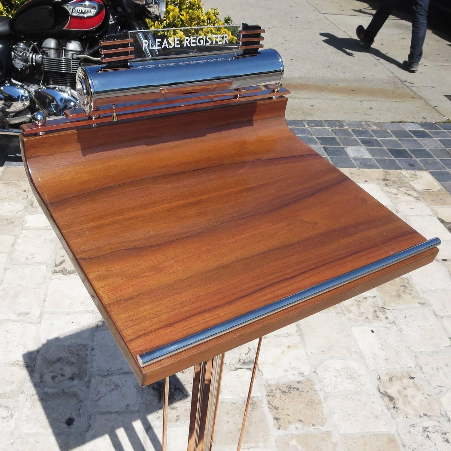 An incredibly glamorous stand in fully restored condition, this beauty will make a great first impression on everyone entering your home or place of business. All the copper and chrome elements have been re-plated, the wooden top has been