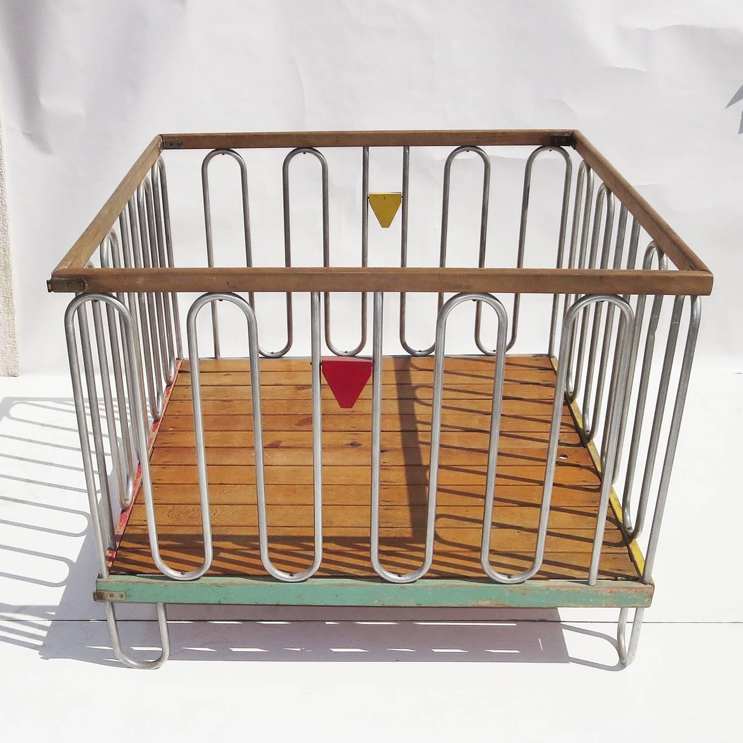Designed by Gilbert Rohde for the Trimble Nursery and Furniture Company of Rochester, NY, this stylized playpen made its' debut at the Chicago Worlds Fair of 1933. The undulating tubes of aluminum were unlike anything seen in the juvenile furniture