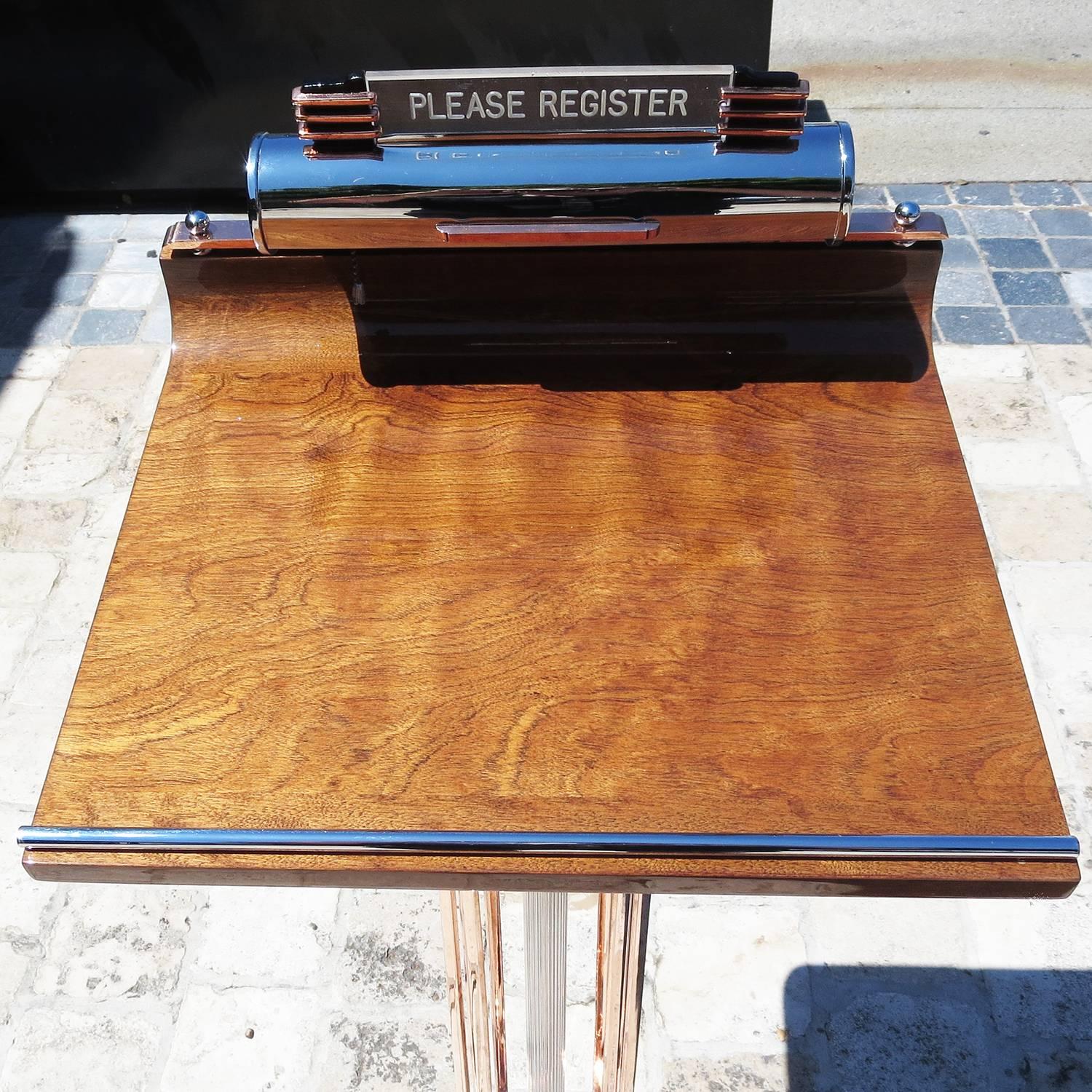 An incredibly glamorous stand in fully restored condition, this beauty will make a great first impression on everyone entering your home or place of business. All the copper and chrome elements have been re-plated, the wooden top has been refinished