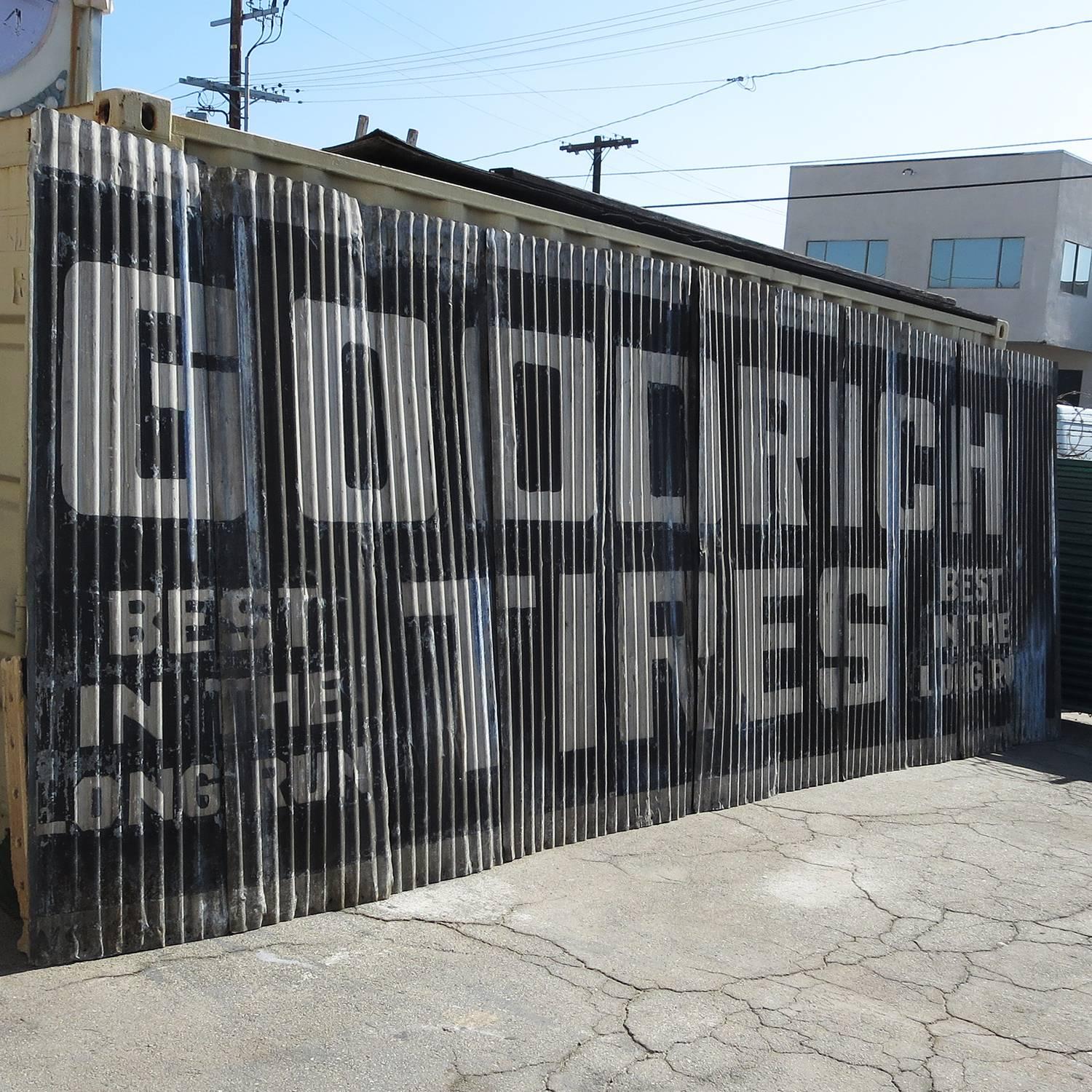 Looking to cover a large wall? This fantastic paneled sign came from an automotive establishment in the 1930s. Each panel overlaps to create the painted billboard, at 23 feet long, by 97 inches tall. The sign displays honest wear of years in the