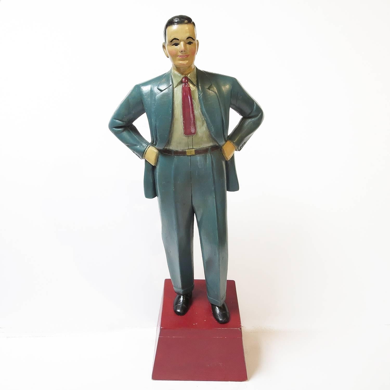 Fantastic and rare! Most store displays were made of plaster or other composite materials. Our dapper gent is hand-carved wood, and retains beautiful original paint. These were used as counter top displays in men’s clothing stores. Wooden examples