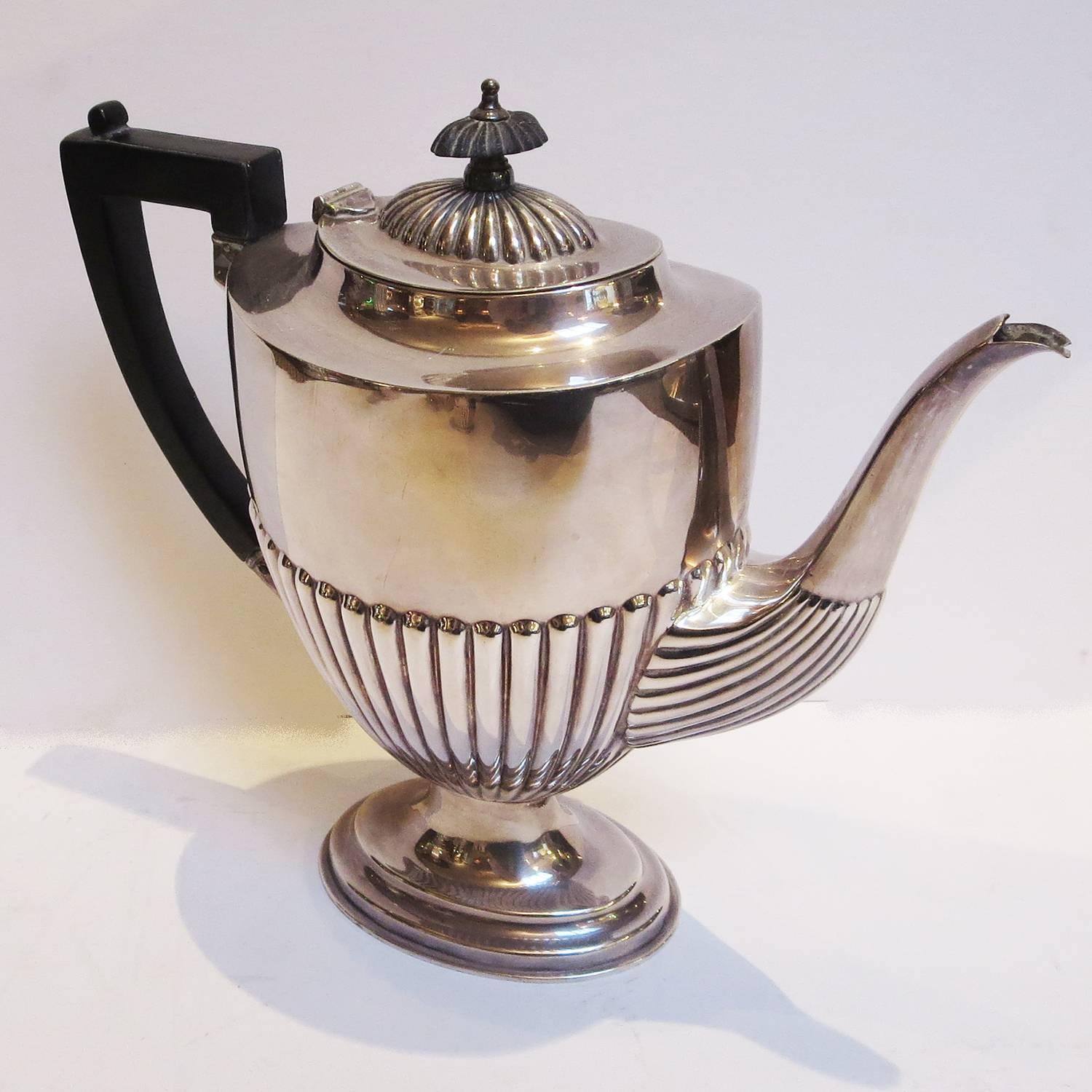 What could be more gracious than to serve your guests and friends from this stylish set? The grouping consists of a tall coffee server, a rounded tea server, a large sugar bowl, and generous creamer. All are in very fine condition, without ant