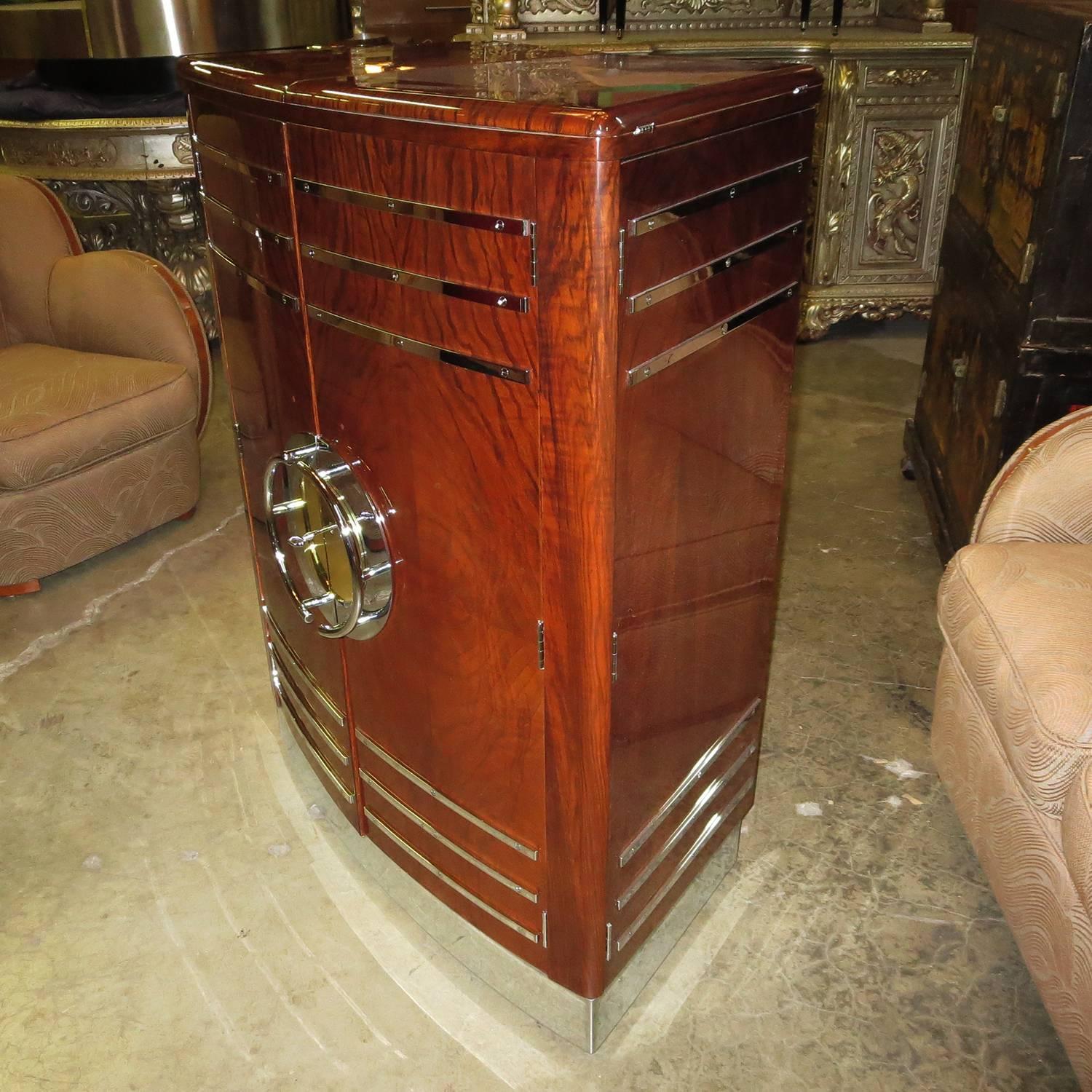 A better design would be hard to find! This lovely restored cabinet has sides that hinge outward to support a fold over top to create a freestanding bar. The cabinet is on wheels so it can be placed against a wall, then rolled away to accommodate a