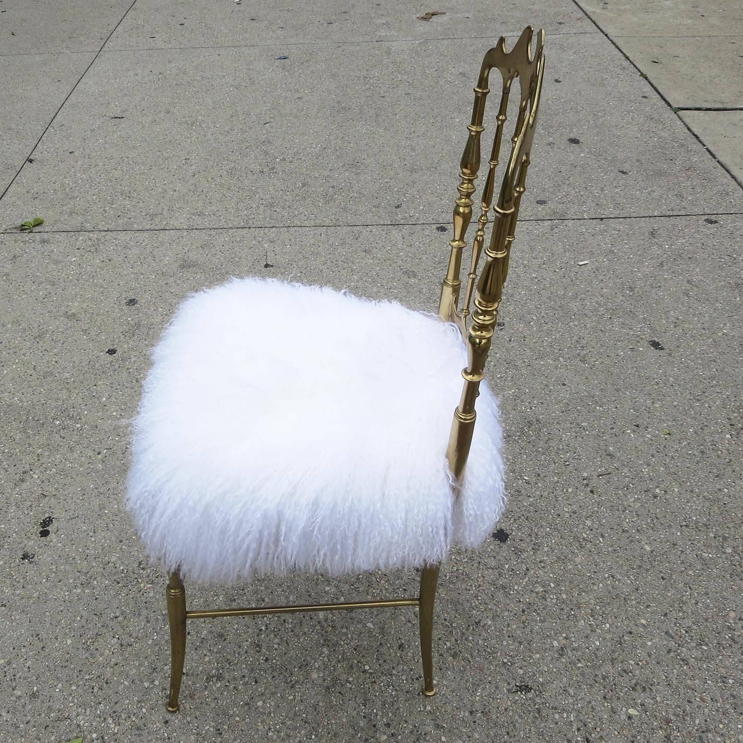 This lovely brass chair was made by Chiavari of Italy in the 1970s. We have just covered the seat in a new soft silky fur.