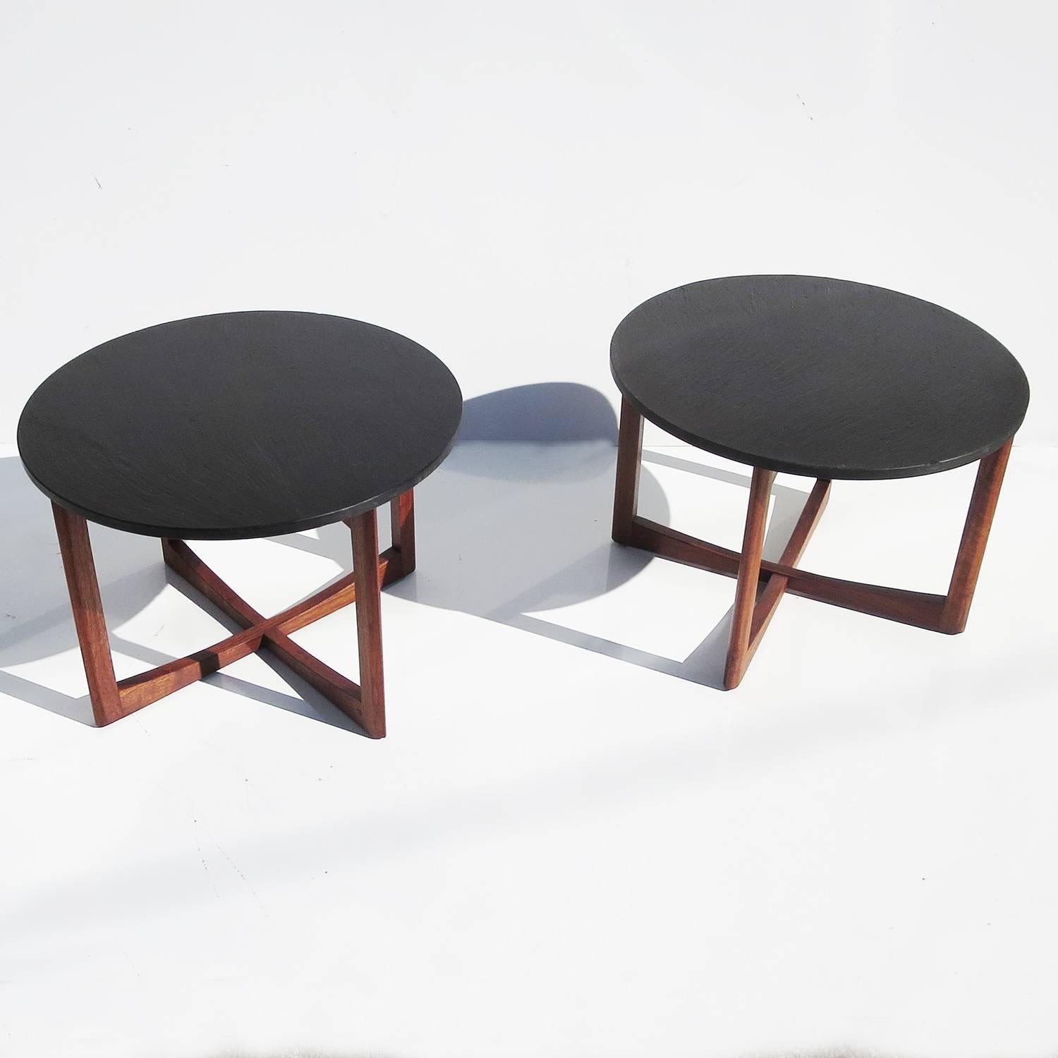 A very stylized pair by unknown designer. The tops are textured black slate, and the bases are satin finished solid walnut. The outside leg edges come to a pleasing taper. Both are in nice original condition.