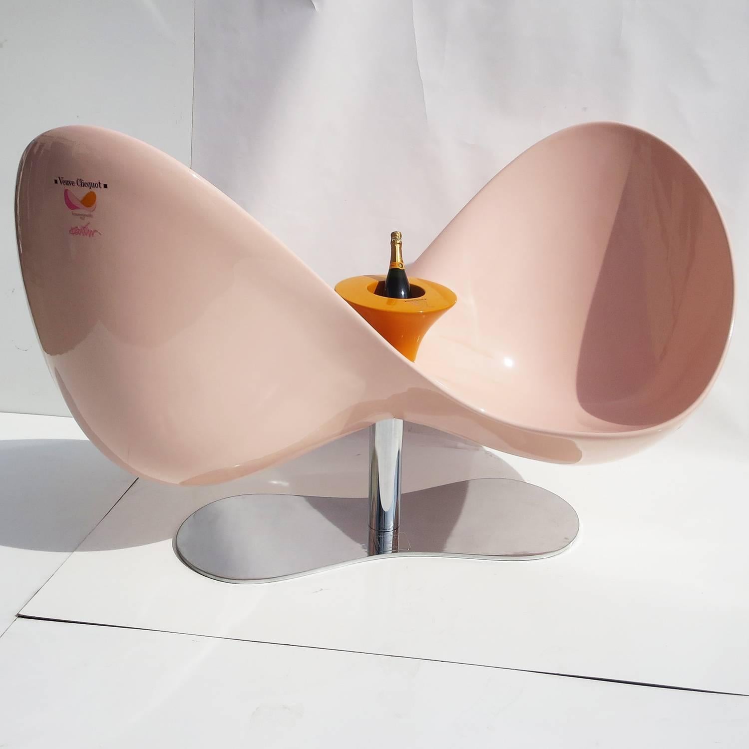 The "Loveseat" designed by Karim Rashid, was produced in Milan in a limited edition of 120 in 2007. Made in conjunction with Veuve Clicquot champagne, the sculptural seats sold out immediately, with an original price tag of $10,000. The