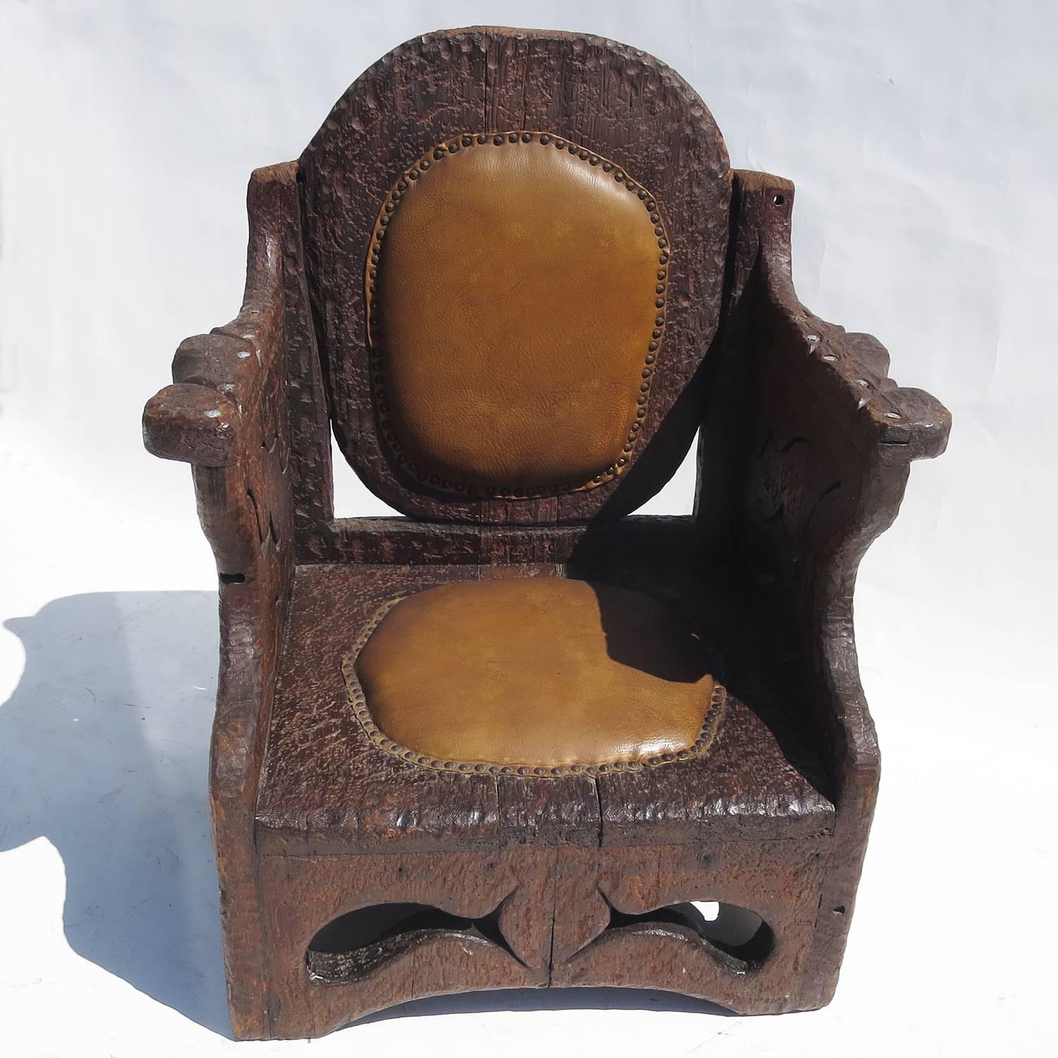 A great example of Folk Art wood carving, in a simple yet effective form. This charming chair is hand 