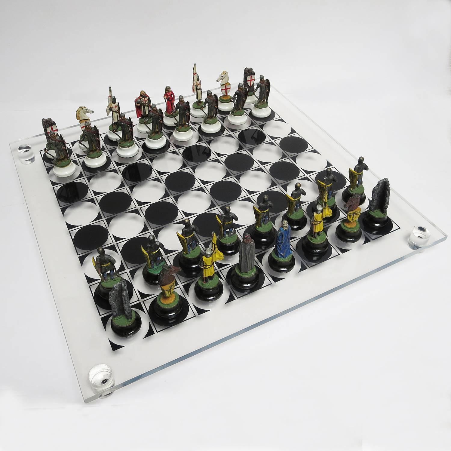 RETIREMENT SALE!!!  EVERYTHING MUST GO - CHECK OUT OUR OTHER ITEMS.				

A great decorative chess set with a see, through Lucite board. All figures are solid lead, and hand-painted. There is various wear to the paint, but the figures are in Fine,