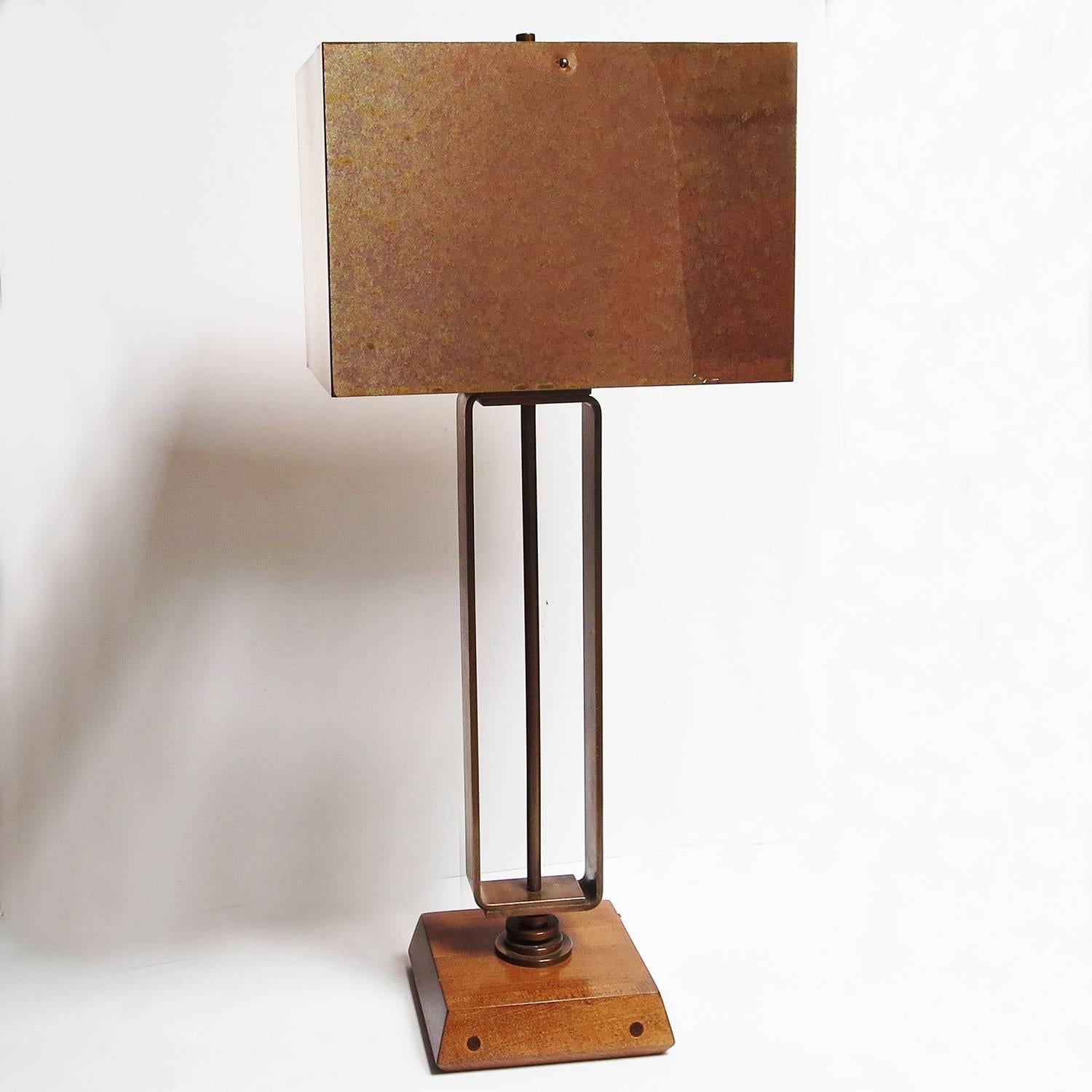 This great pair of lamps, by unknown creator, recall the designs of Donald Deskey or Gilbert Rohde. The shades are thin copper sheet, folded into form. The bases are a heavy weight copper bar, curved to meet at the bottom. The bases are refinished