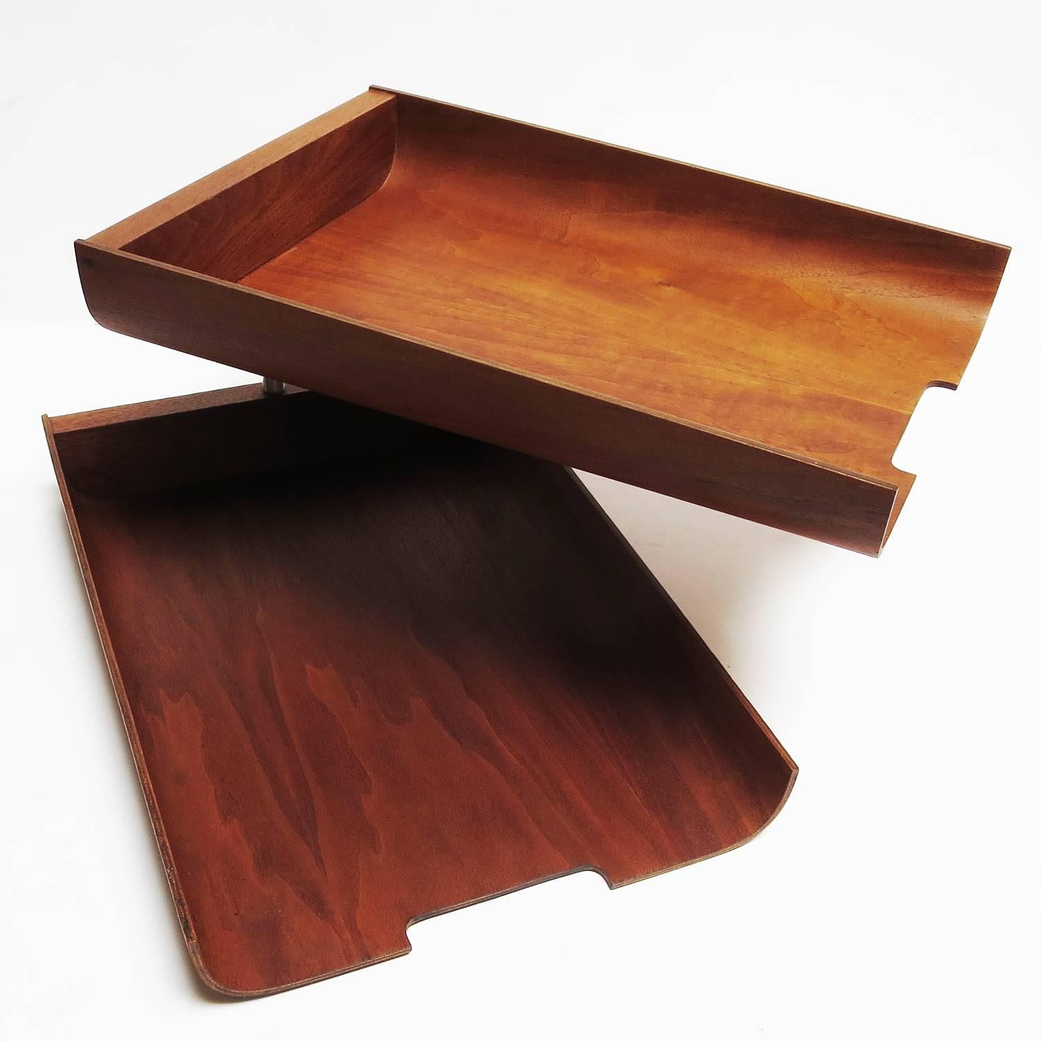 Influenced by the Florence Knoll letter trays, designer Martin Aberg created these similar trays for the Rainbow Wood Products Company of Sweden. The trays will swivel, or stack straight. Each tray is two inches deep, and are in very fine original