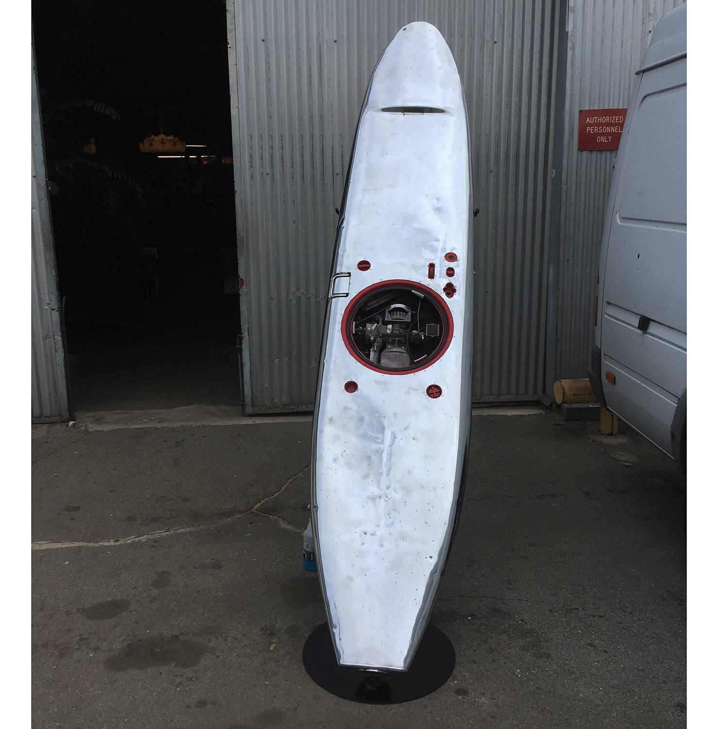 Produced from 1965 to 1968, the jet board was the design of a former Boeing Aviation engineer. The aluminum surfboard is powered by a 6.25 horsepower Tecumseh engine and jet propulsion system. Air is vented through the front of the board and