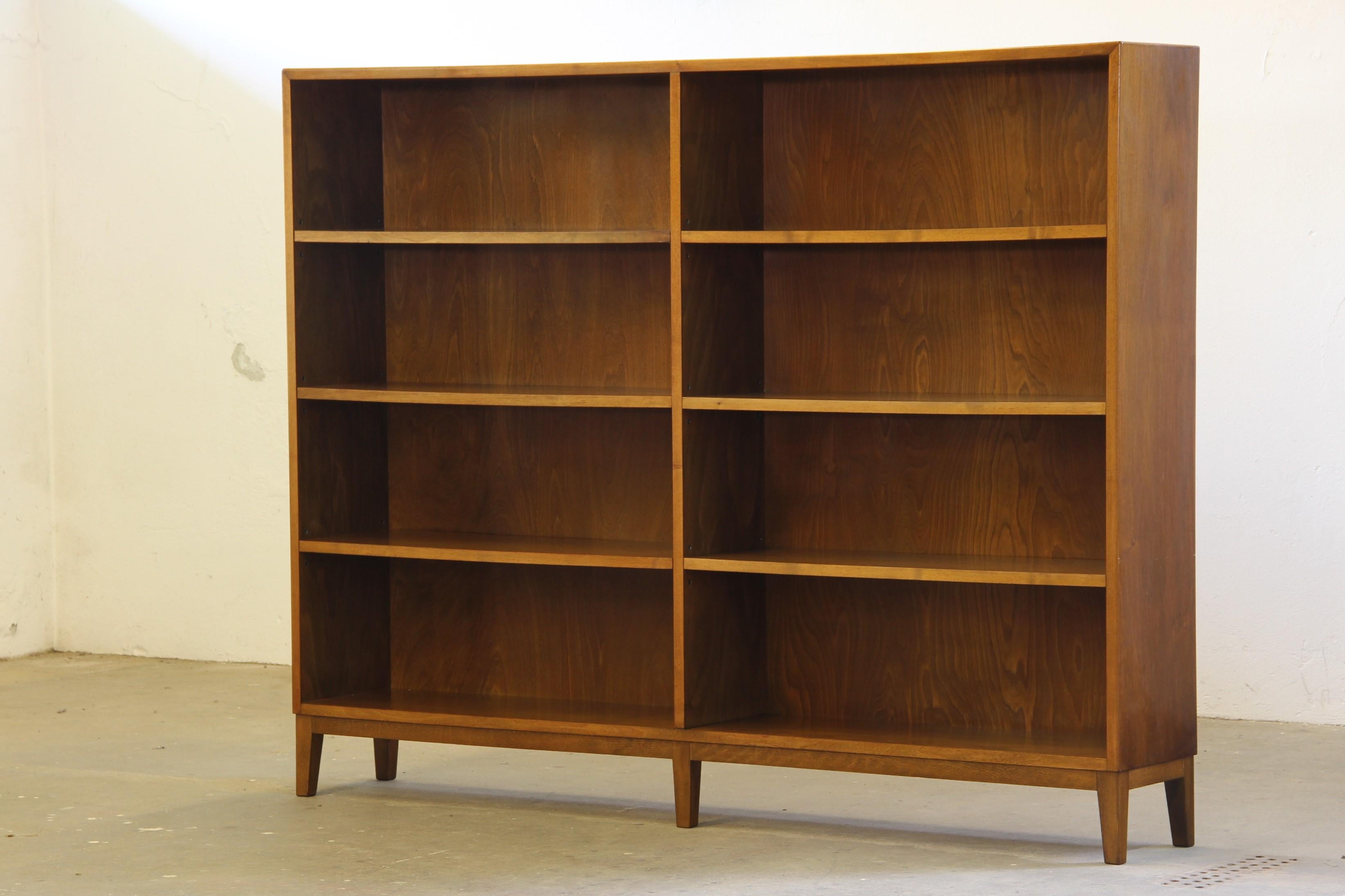 Beautiful Nutwood Bookcase with adjustable shelves, this elegant bookcase has a light and airy expression. Its slim depth means it doesn't take up much space in the room, while still offering plenty of storage for your entire book collection.

It's
