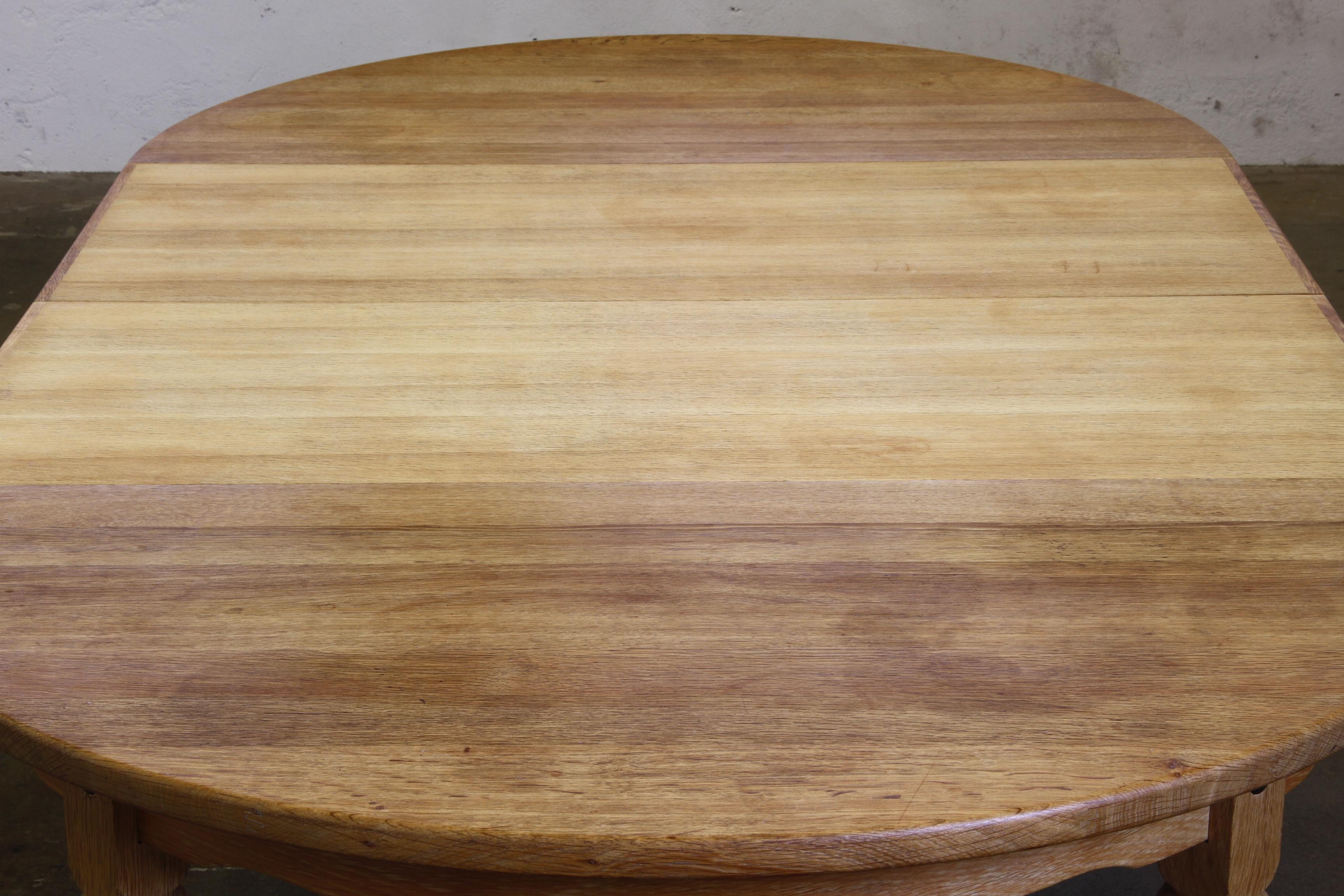 1960s Danish Round Extendable Dining Table in Oak style of Henning Kjærnulf For Sale 8