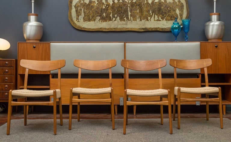 Fully restored original set of eight Hans J Wegner CH 23 chairs for Carl Hanson & Son, circa 1951.
 Refinished oak and teak frames with new woven Danish cord seats.
