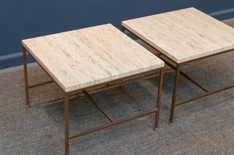Pair of vintage travertine top end tables in the style of Paul McCobb for Calvin. The travetine tops are in excellent condition on patinated copper bases.