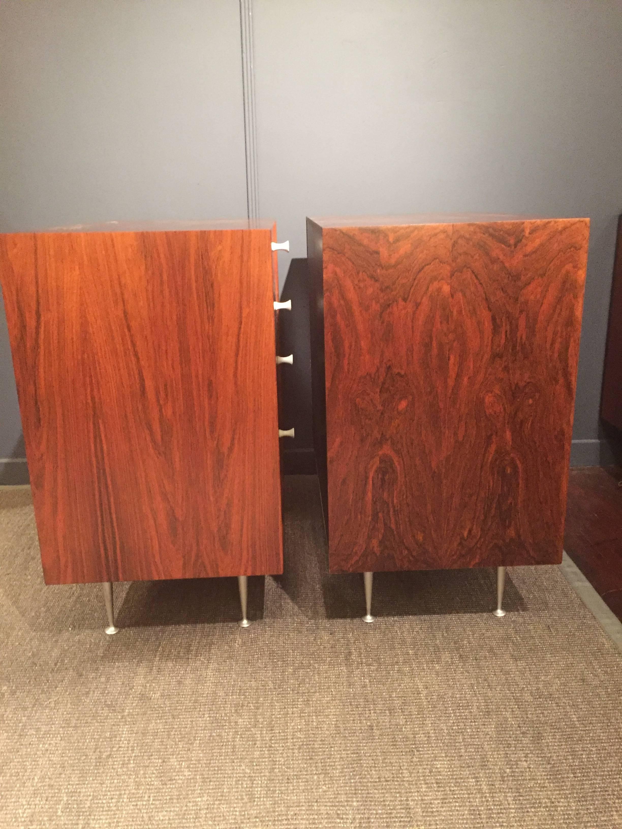 Original matched pair of chests designed by George Nelson for Herman Miller. Perfectly refinished rosewood in dramatic grains with fitted interiors, labeled.