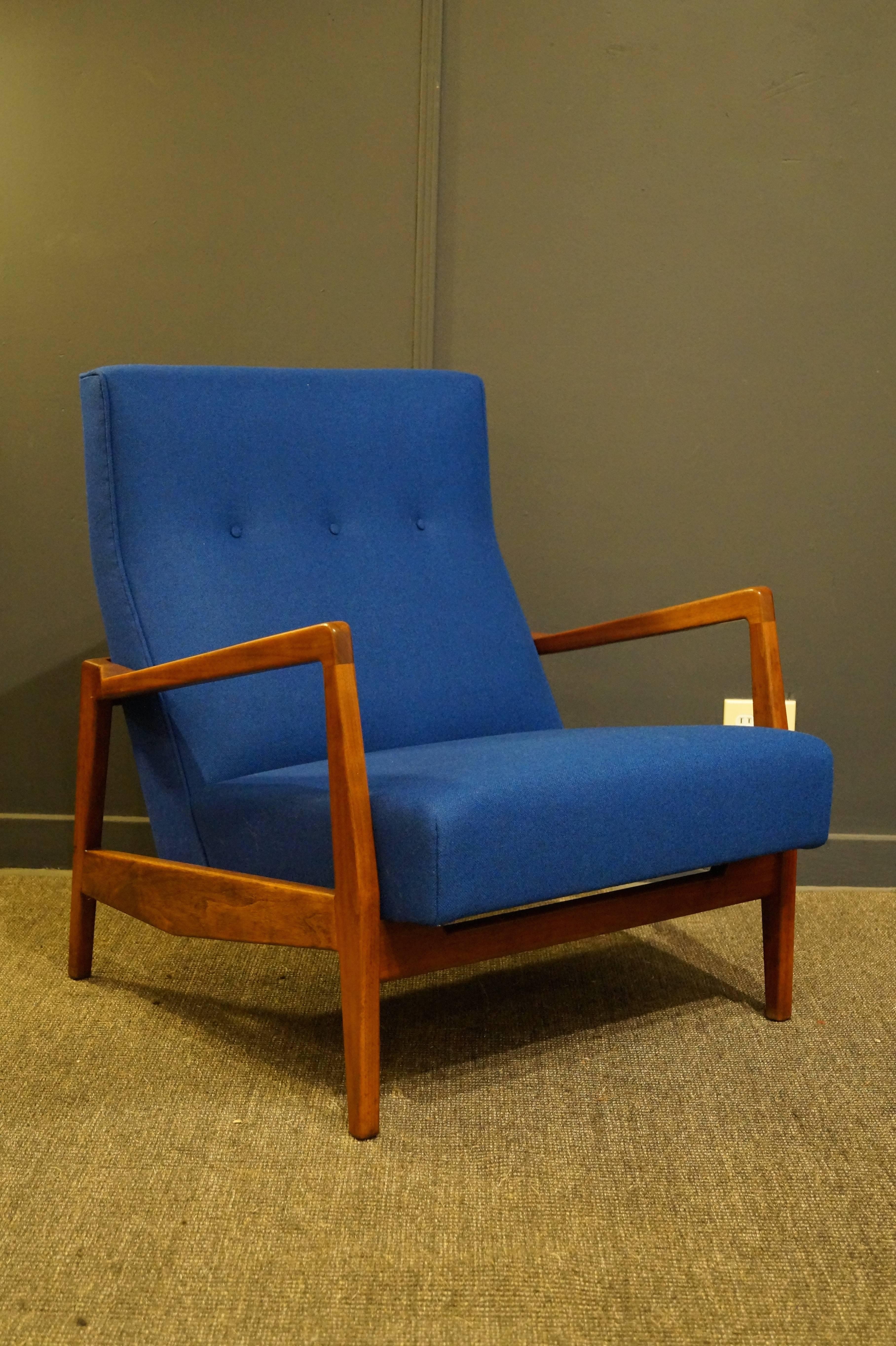 Rare chair by the infamous Jens Risom made from solid walnut with signature angular details. This is great for big or small with generous proportions and comfort for all. 
Newly refinished and upholstered in Kvadrat wool, labeled.