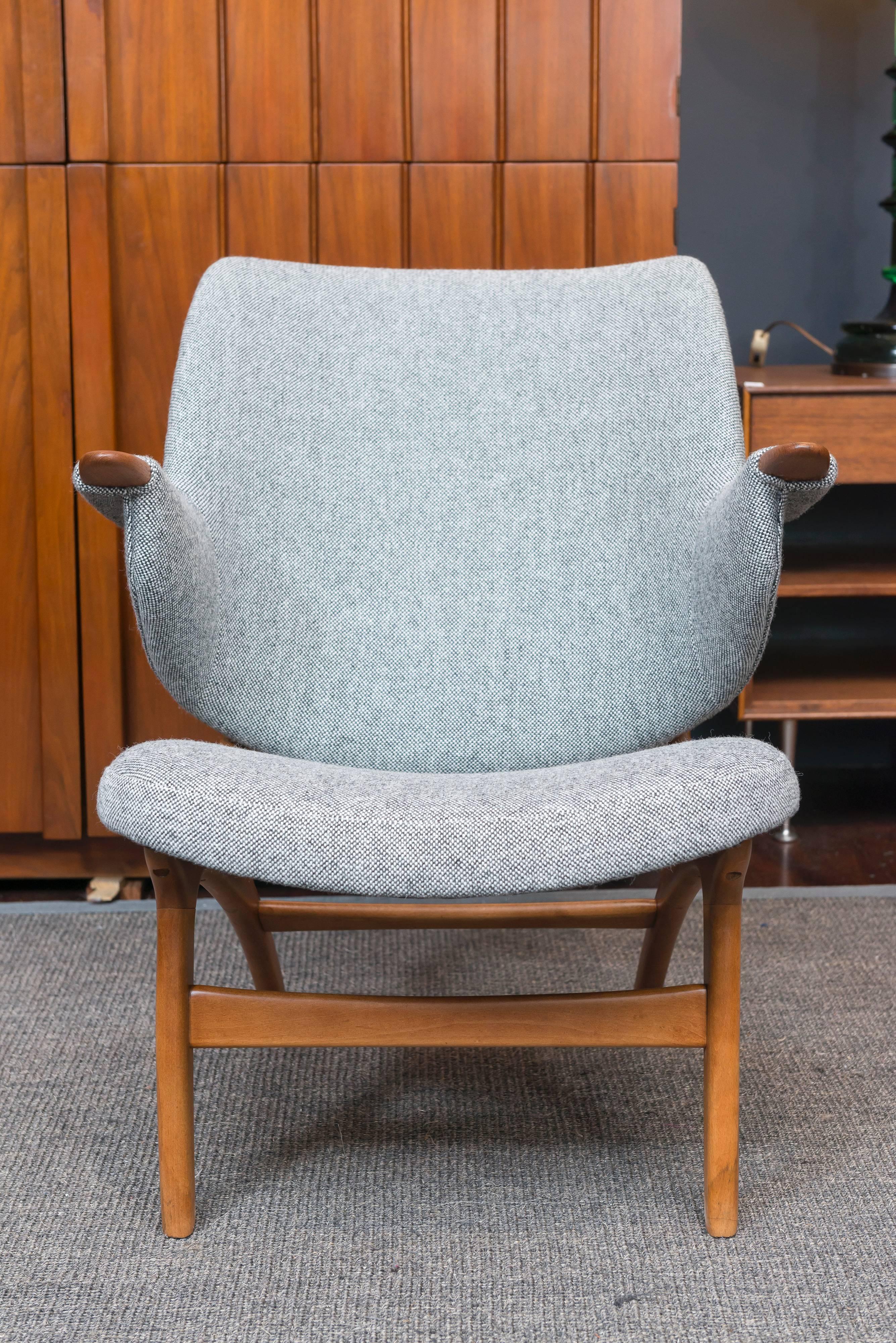 Super comfy Scandinavian Modern teak lounge chair newly refinished and upholstered in Danish wool.