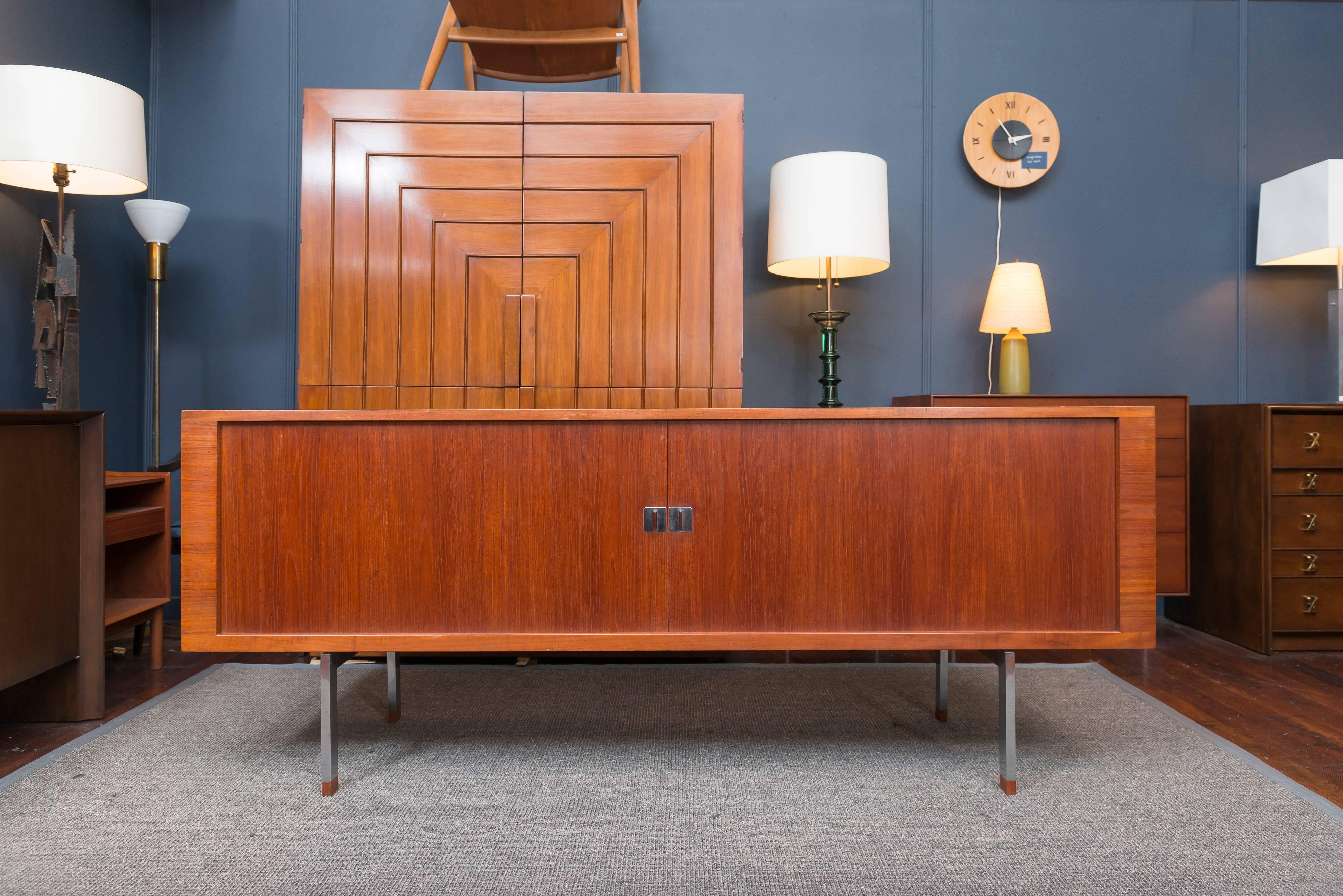 Hans J Wegner design "President"teak tambour door credenza for Ry mobler with fitted oak interiors on an elevated stainless steel frame.
Perfectly refinished and ready to enjoy.