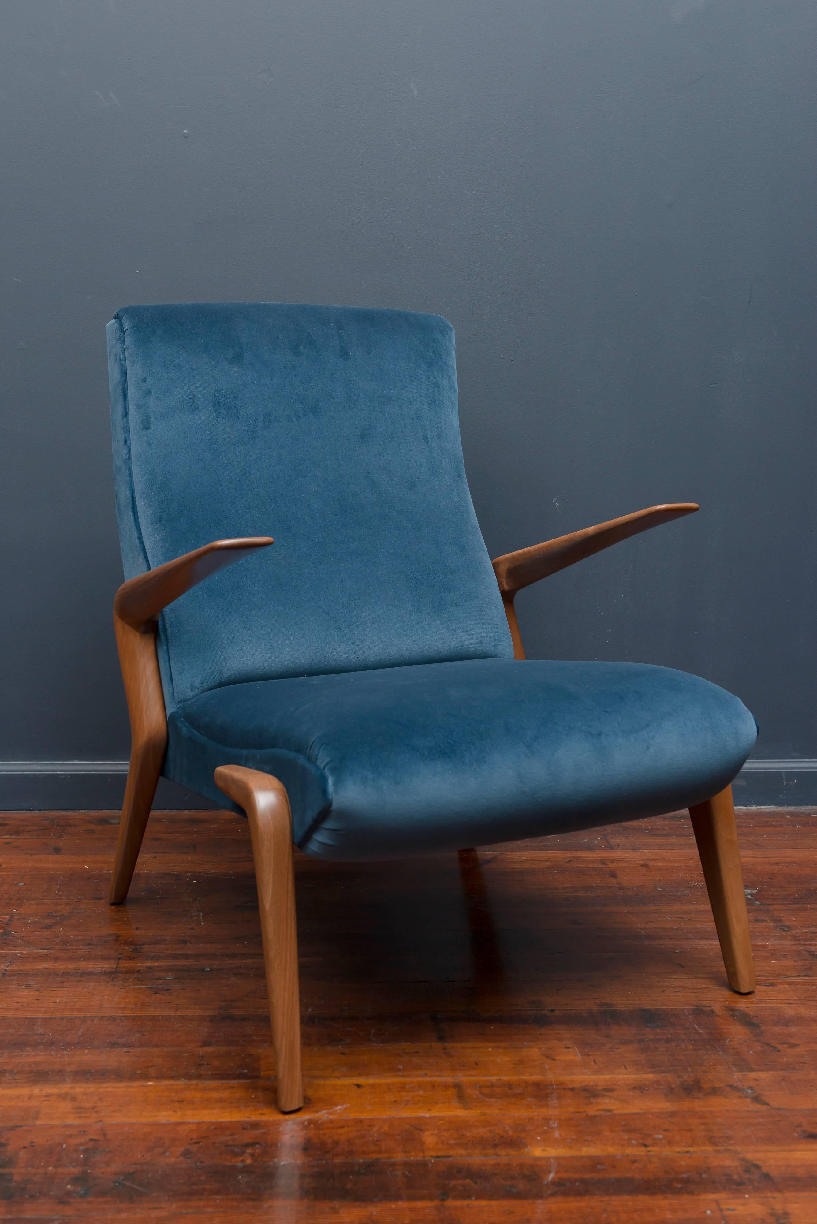 Rare Osvaldo Borsani design lounge chair for Tecno, Italy. Perfectly refinished walnut and newly upholstered, super comfy.