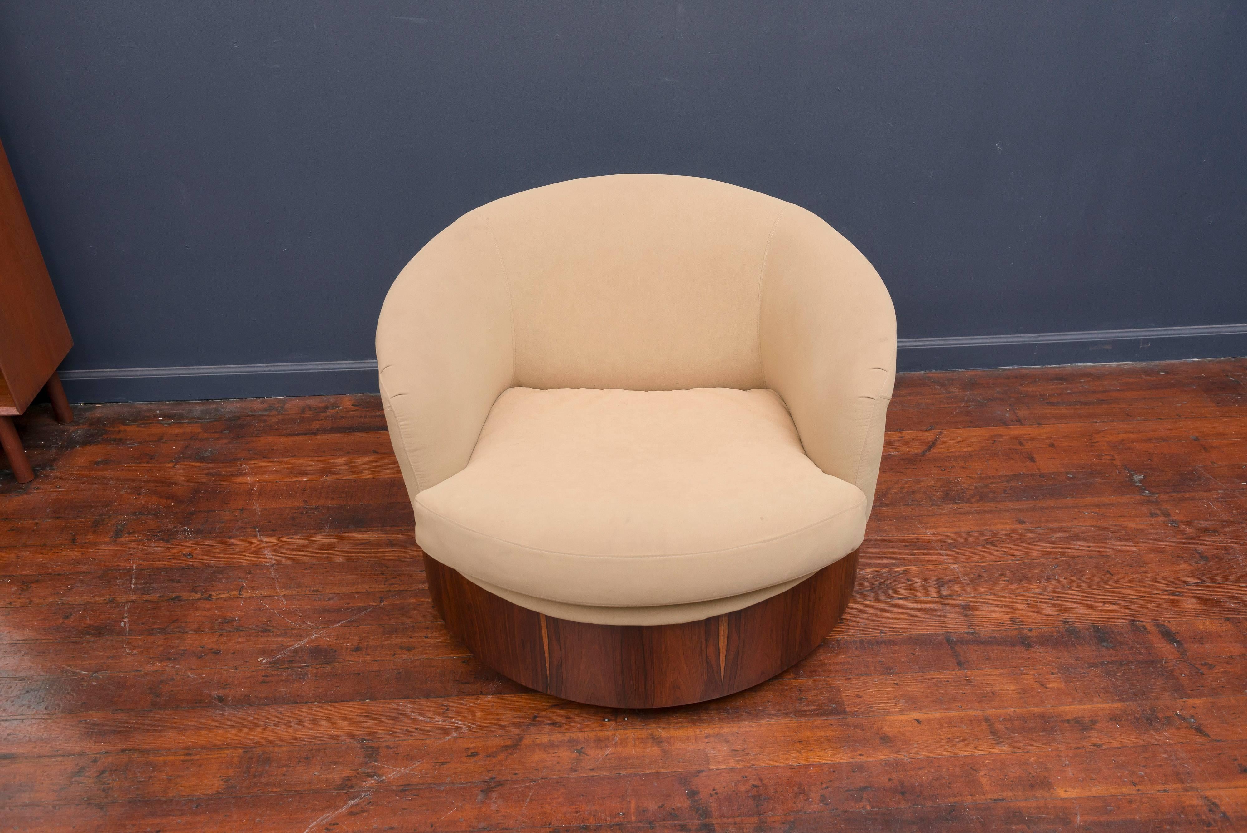 Rare form rosewood veneer swivel lounge chair designed by George Mulhauser for Plycraft. Newly refinished and ready to upholster or use as-is, very comfy.