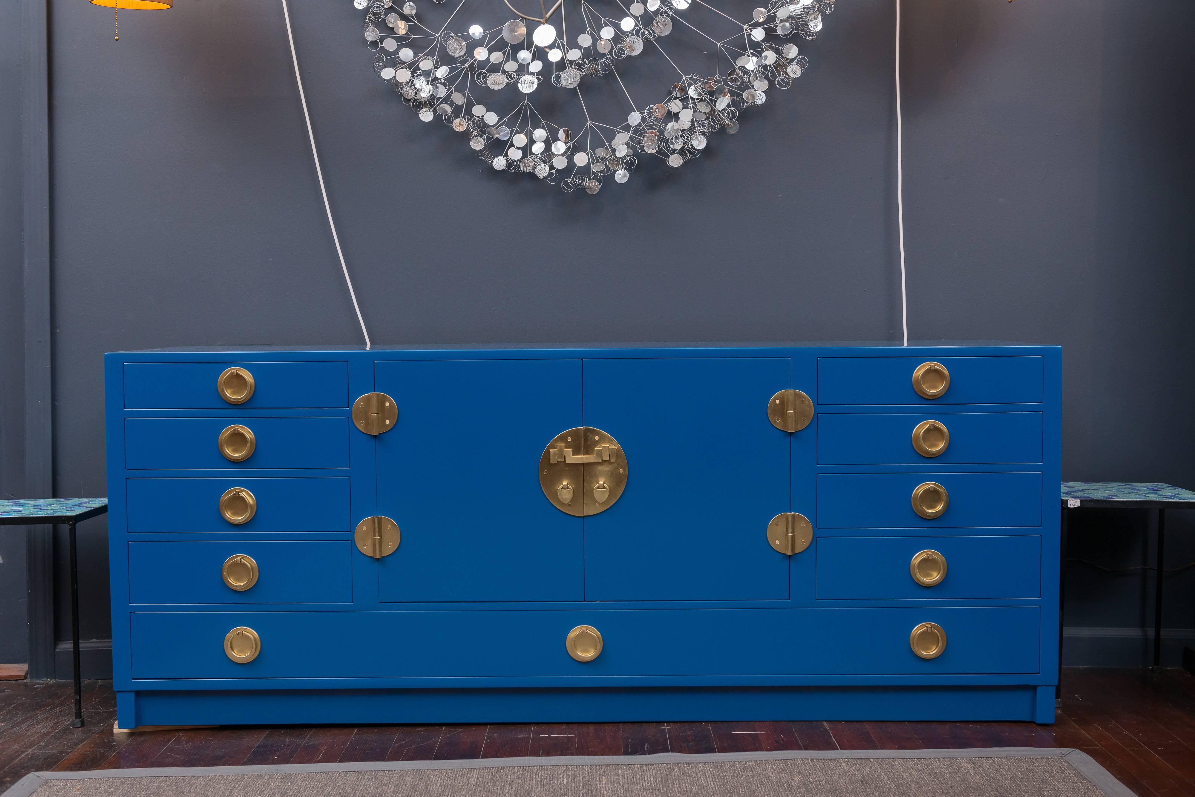 Asian style credenza with brass hardware and new blue lacquer designed by Edward Wormley for Dunbar.