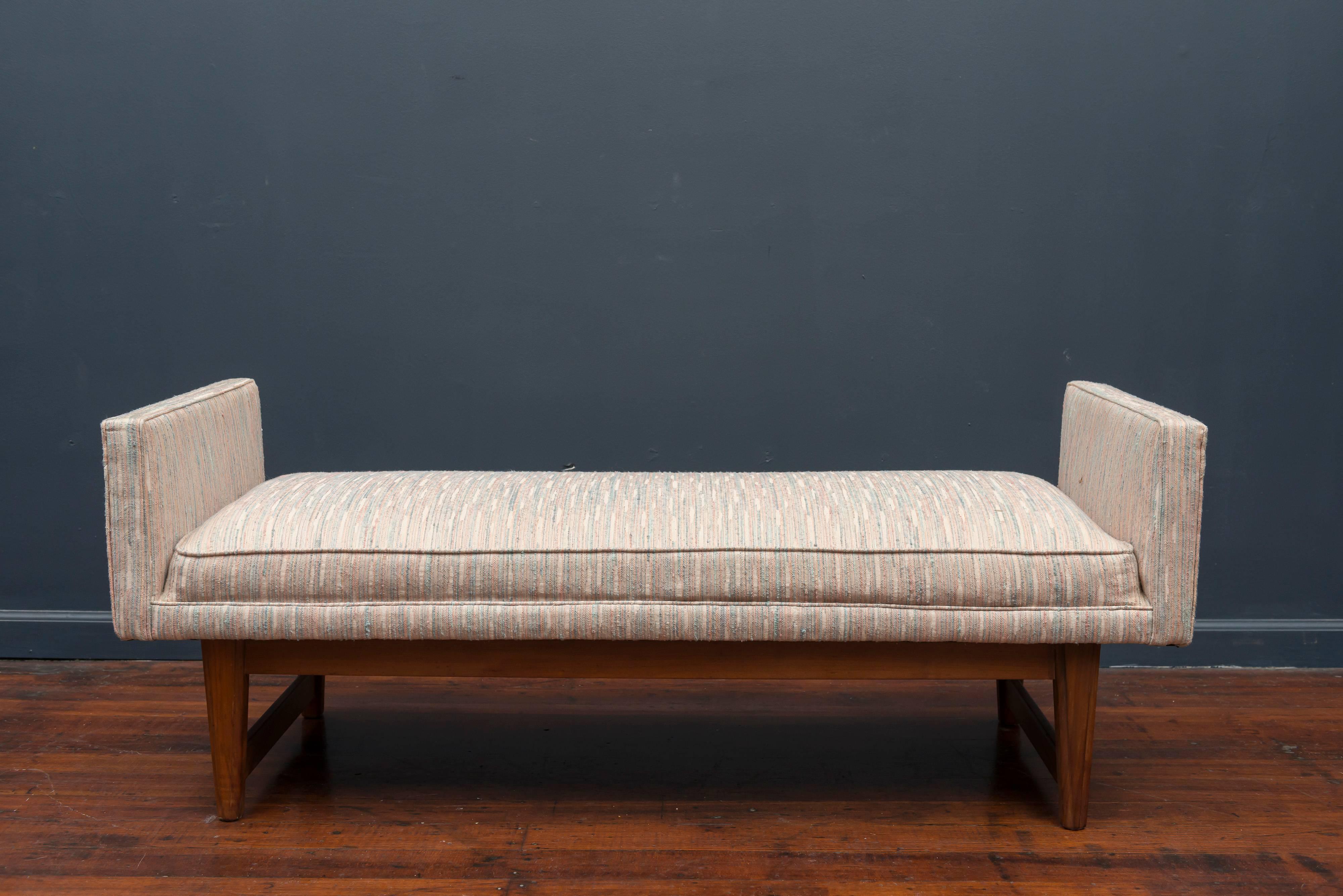 Mid-Century Modern design bench by Selig. Classic lines, well made and ready to be re-upholstered or use as-is on a walnut base.