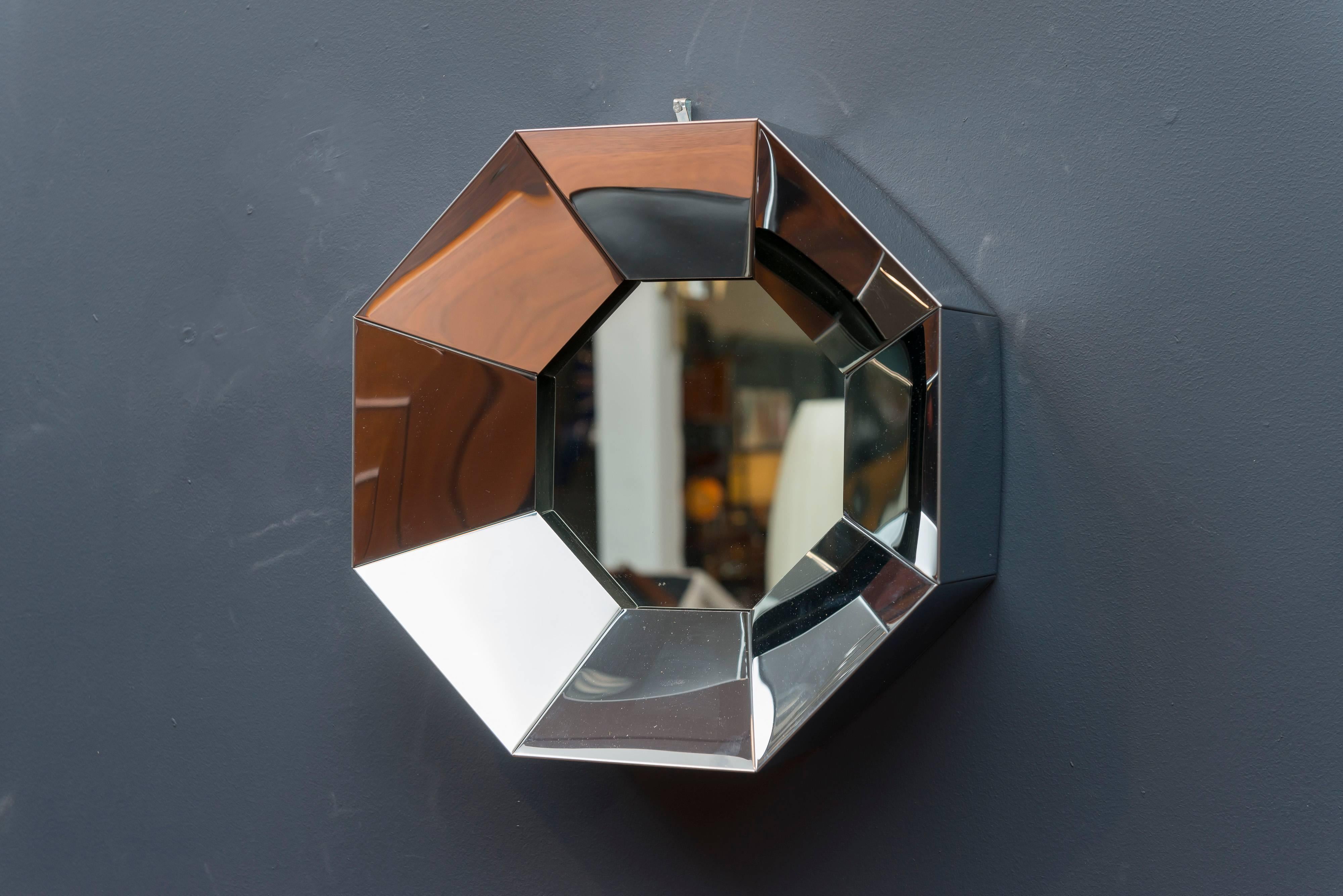 Striking octagonal design chrome wall mirror by C.Jere, signed and dated 1976.