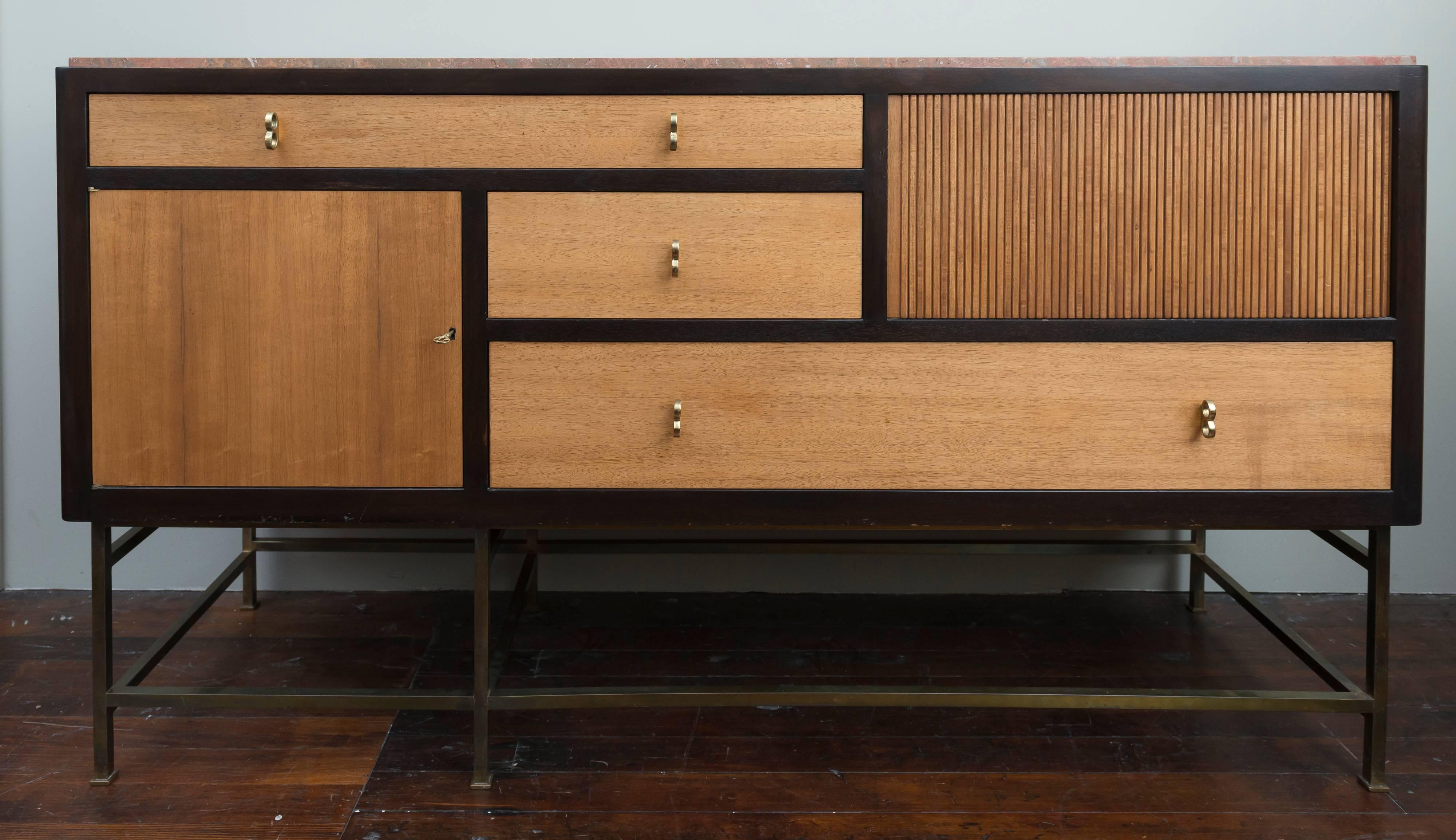 Large and impressive Edward Wormley design sideboard for Dunbar Furniture co. Model #5465. In my opinion his best designed and sophisticated sideboard or credenza for Dunbar. Made from dark stained mahogany and striking Tawi wood doors and drawers