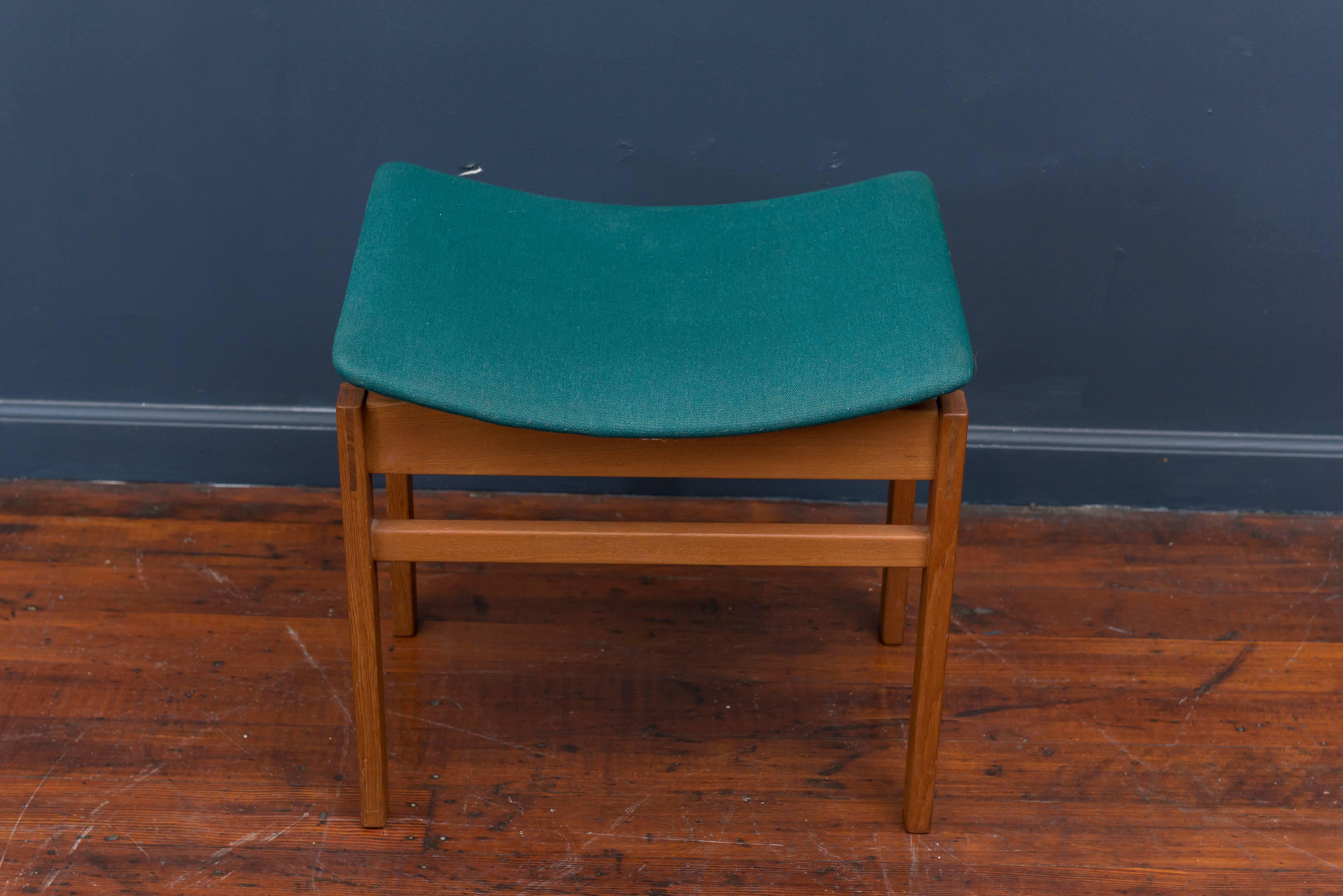 Architectural design Danish teak foot stool made by France & Davoriksen, Denmark. Excellent original condition finish and fabric ready to enjoy!