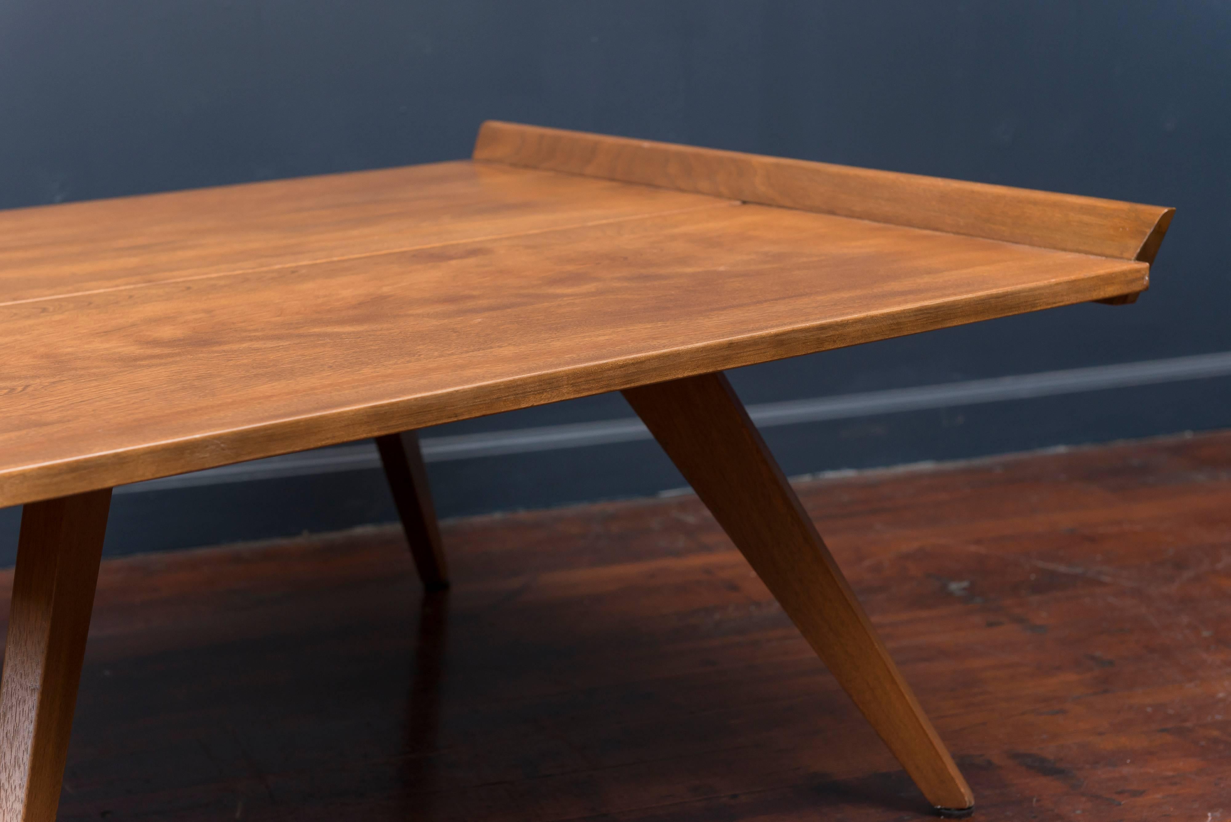 Rare early design from George Nakashima for Knoll, 1947. Made with solid birch planks trimmed in walnut with oak legs, refinished recently.