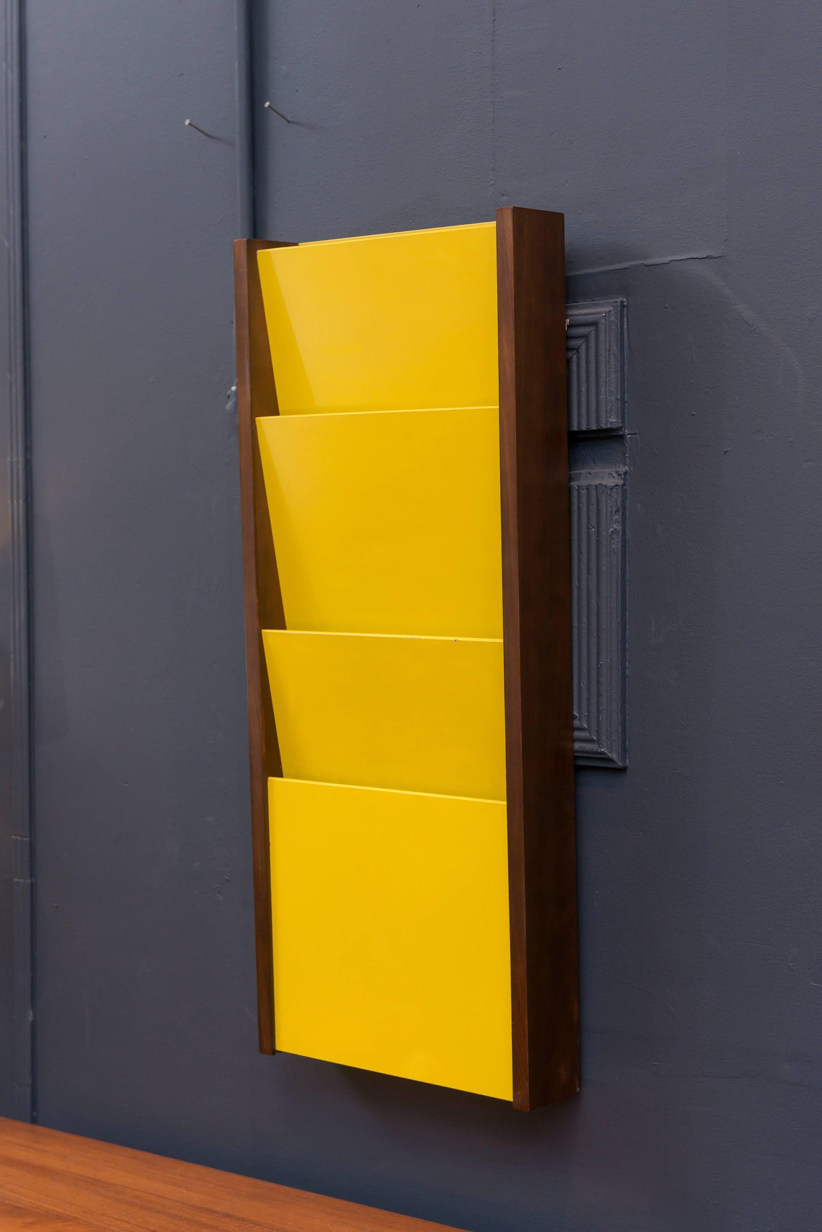 Fun yellow magazine rack mad by Peter Pepper Products.
