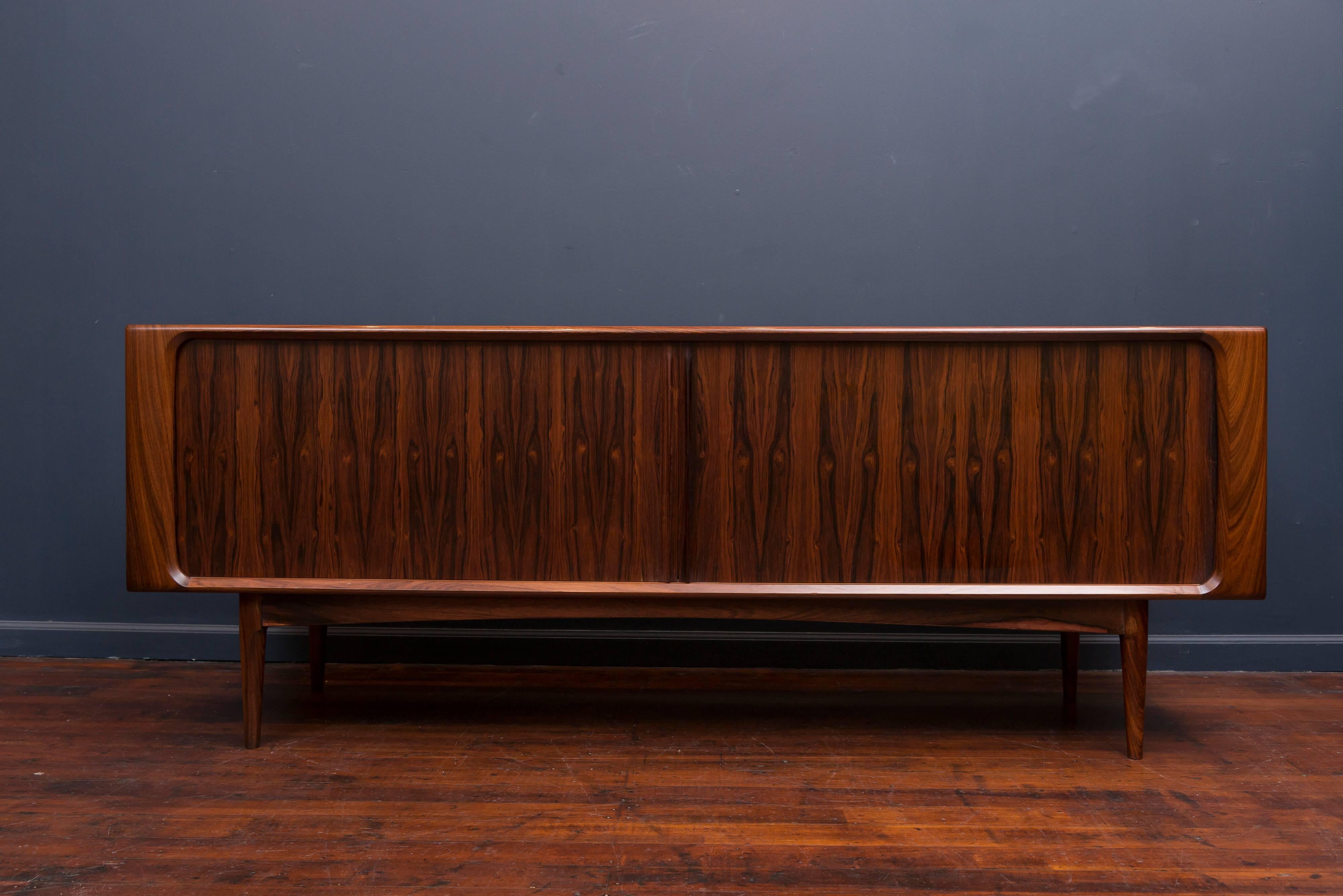 Exceptional quality design tambour door credenza with highly figured rosewood grains throughout and a fitted interior.