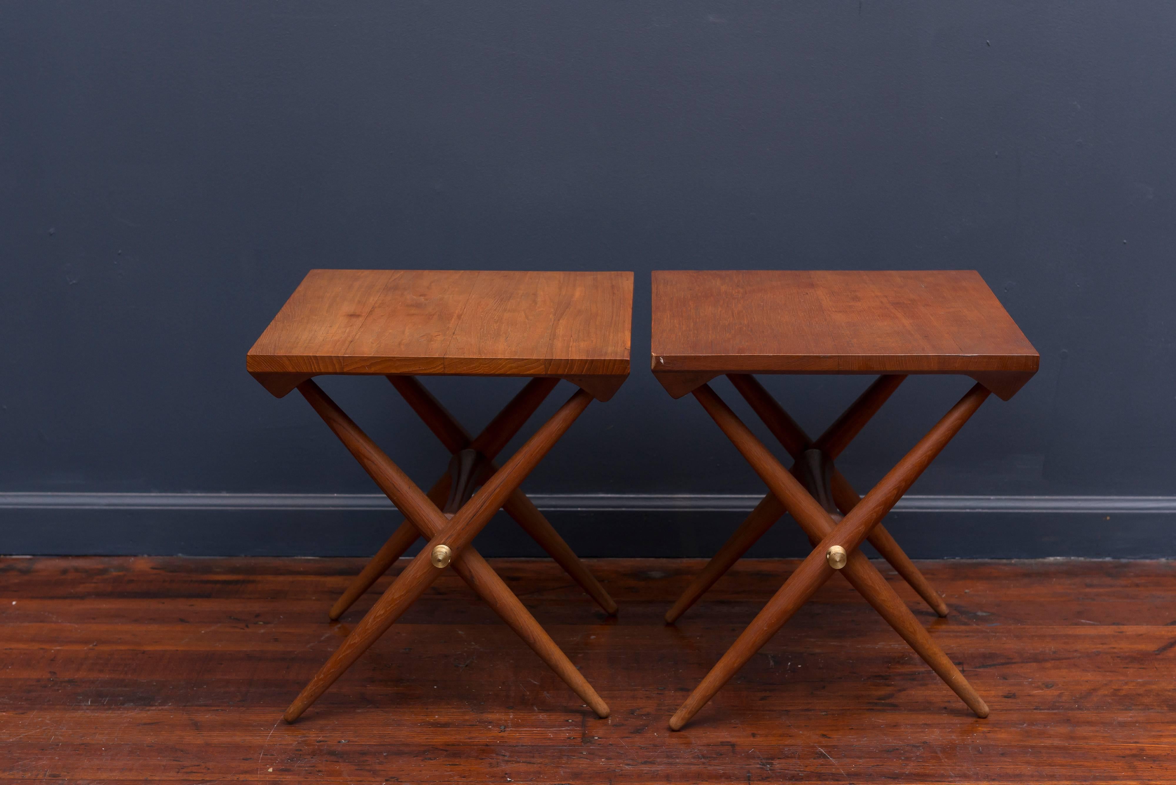 Rare pair of Jens Quistgaard design end tables in solid teak with machined brass fittings, stamped.