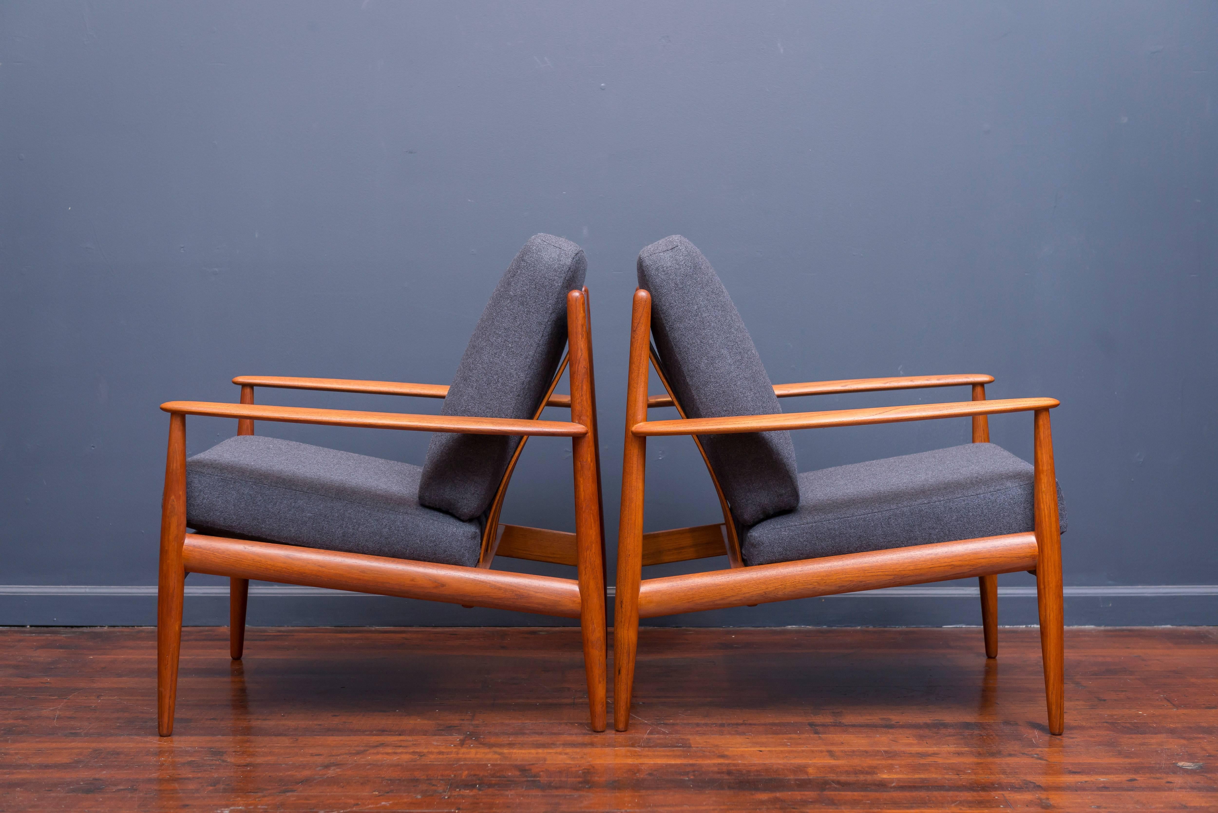 Pair of Greta Jalk design teak lounge chairs for France & Davoriksen, Denmark. Perfectly refinished with new cushions in Danish wool, labeled.