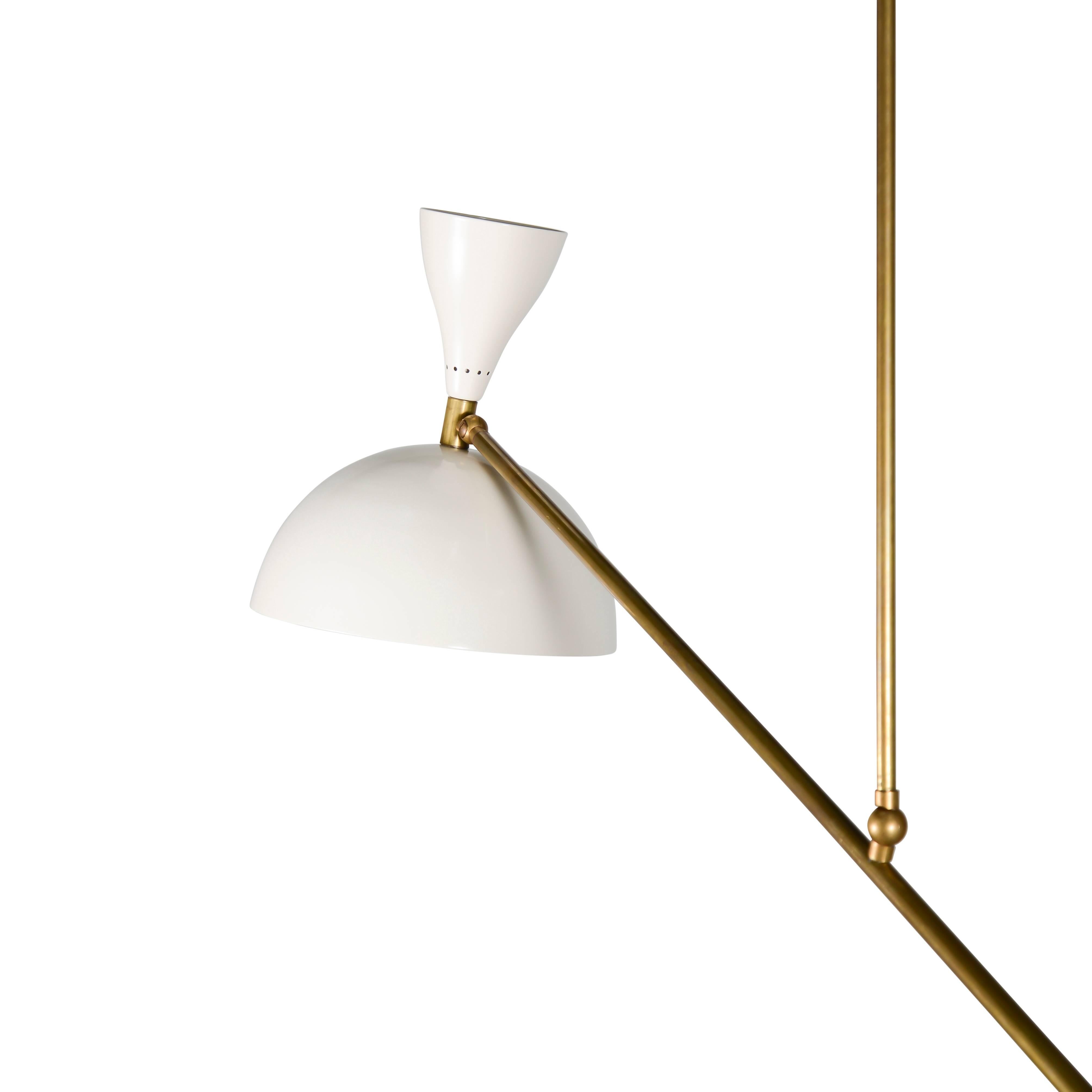 Brass articulating pendant lights with gloss ivory shades and counterbalancing spheres. Two available.