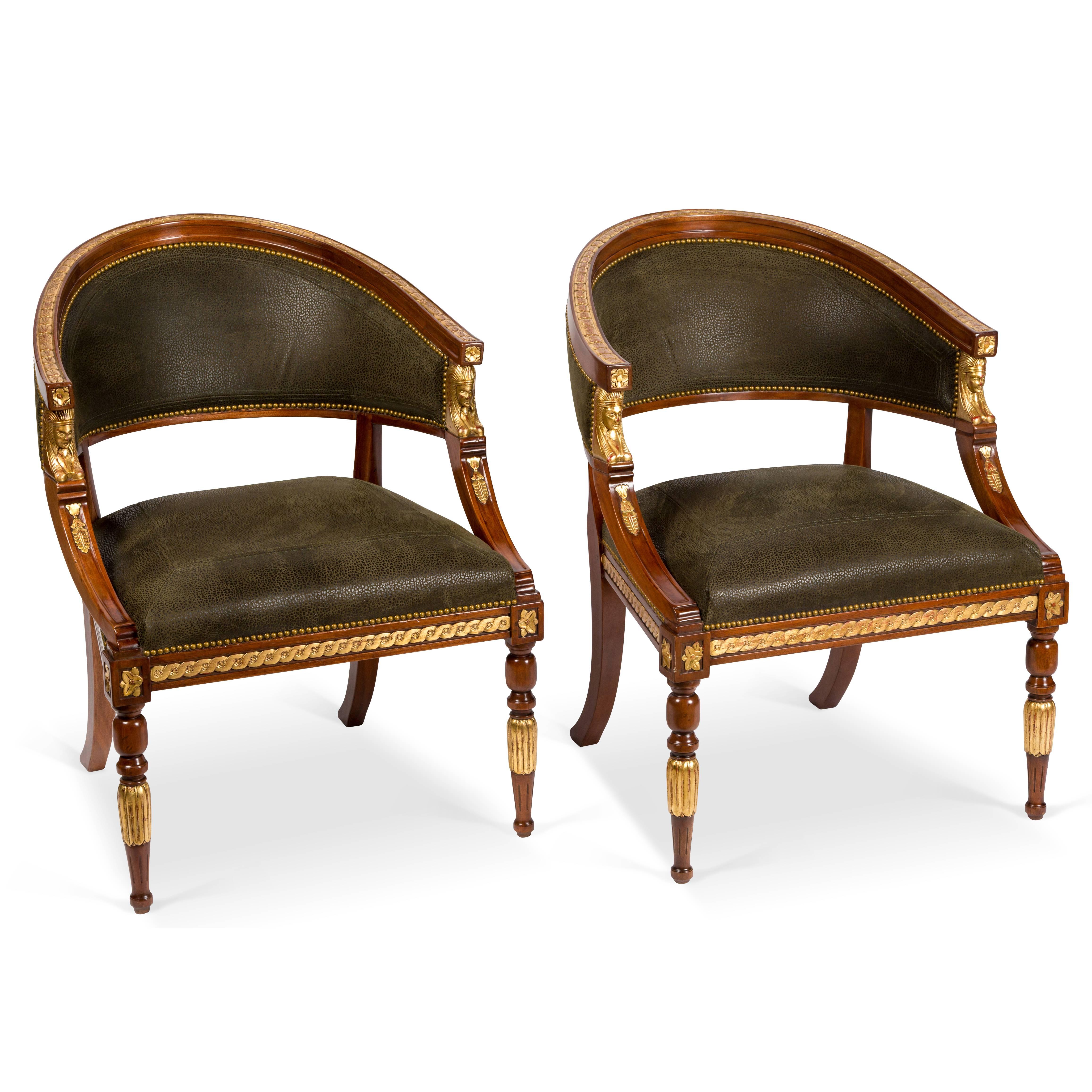 Pair of vintage Swedish tub chairs, mahogany frame with turned fluted wood legs, water gilt detail. Upholstered in Military color Boar Hide. Hide has a nubuck/suede texture.