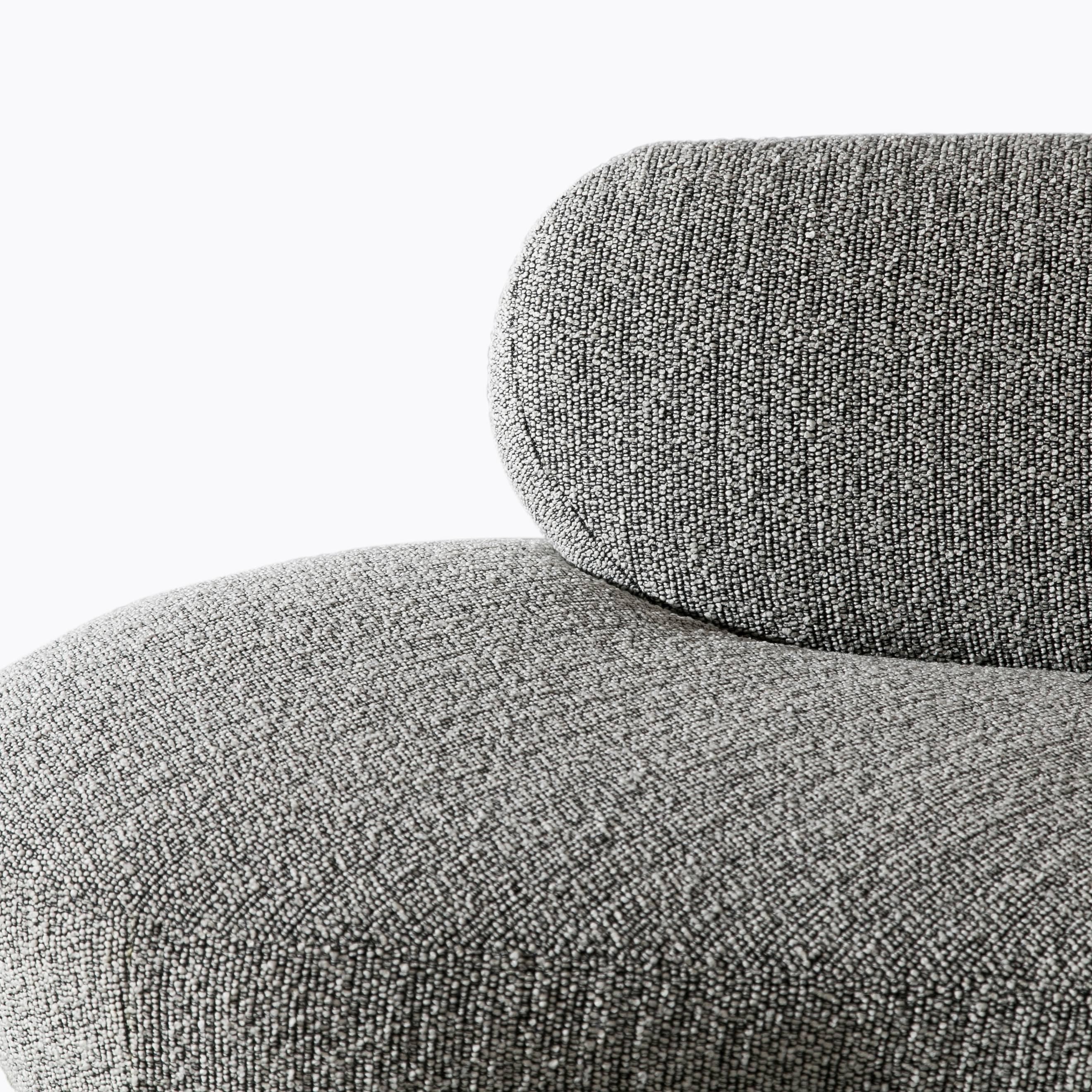 Iconic biomorphic sofa upholstered in black and white wool bouclé with Lucite centre support.