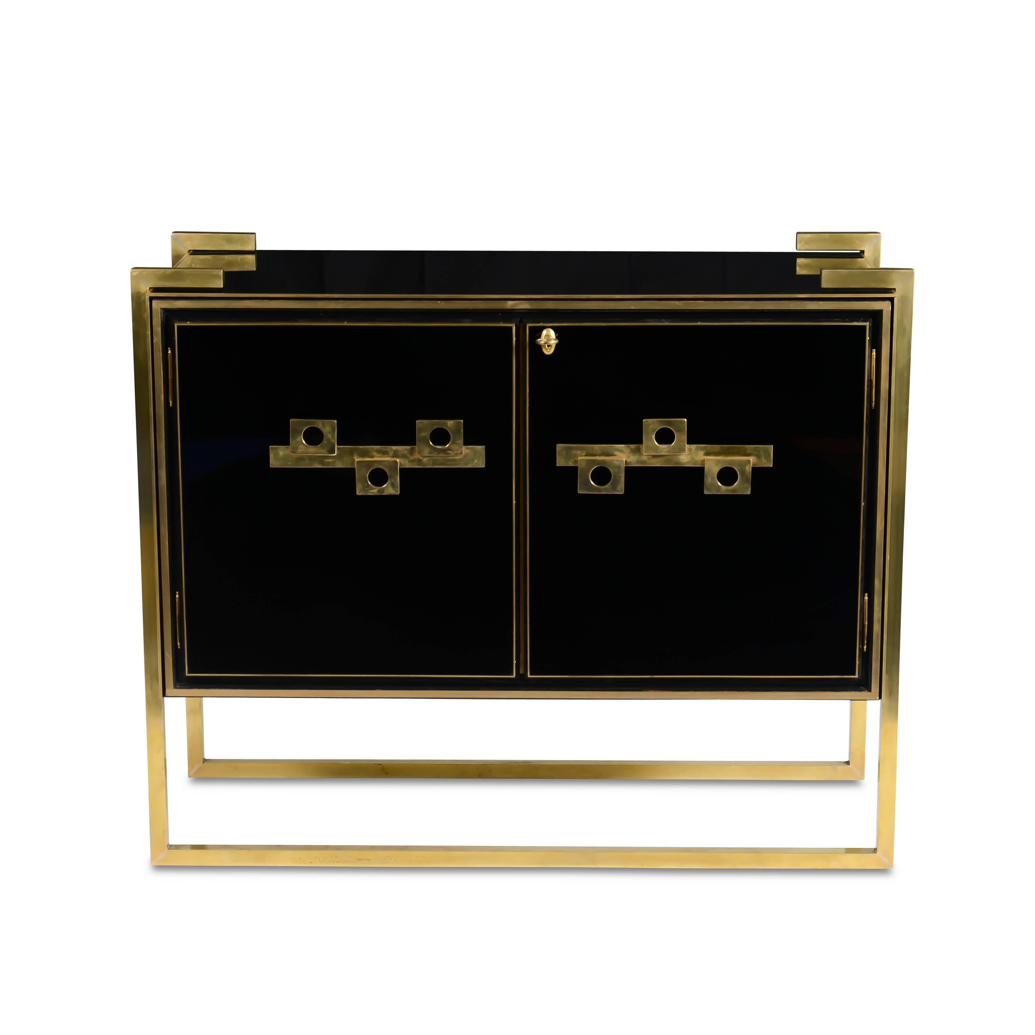 Black reverse painted glass two-door cabinets with brass detail, pulls and legs.