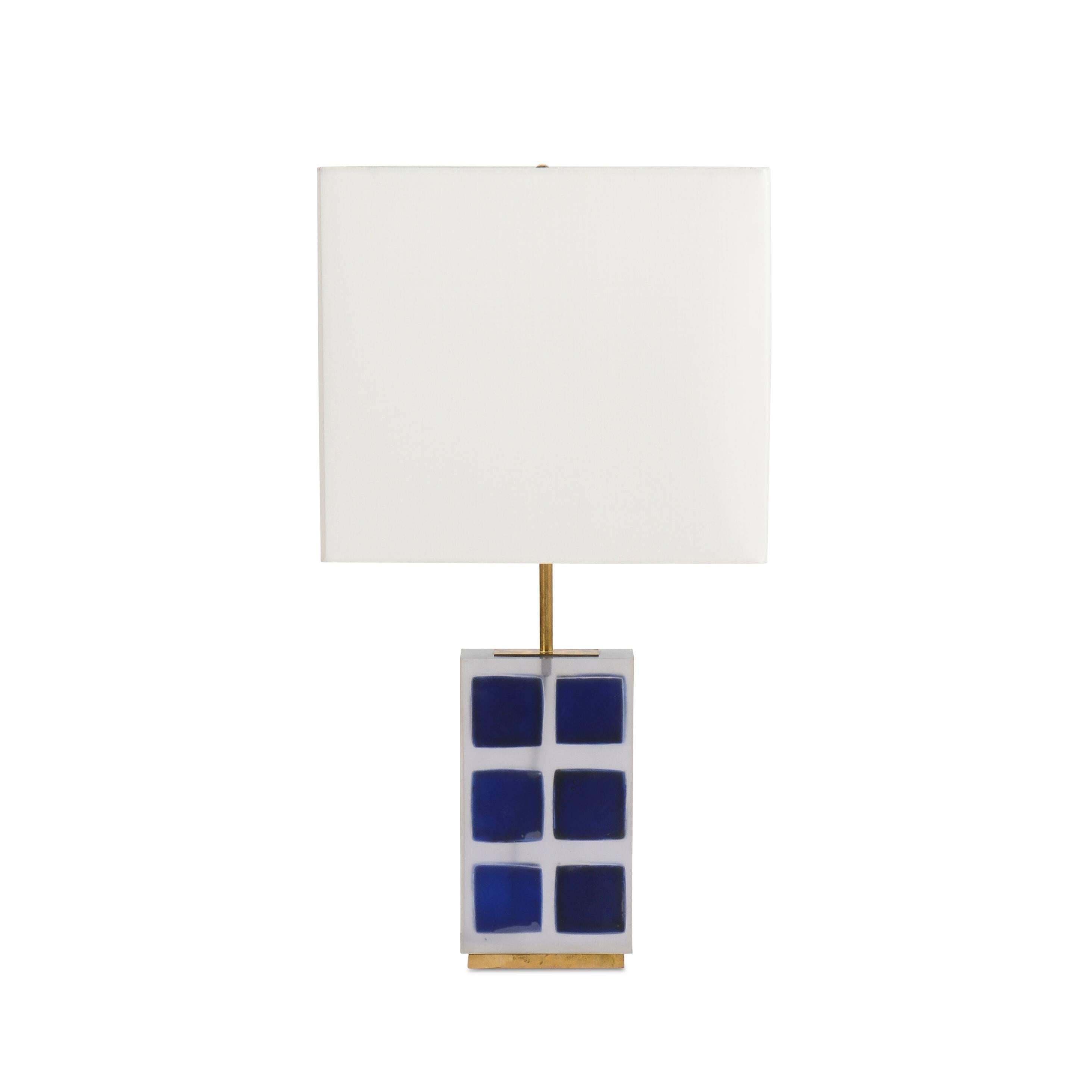 Pair of clear resin table lamps with floating blue cubes.
  