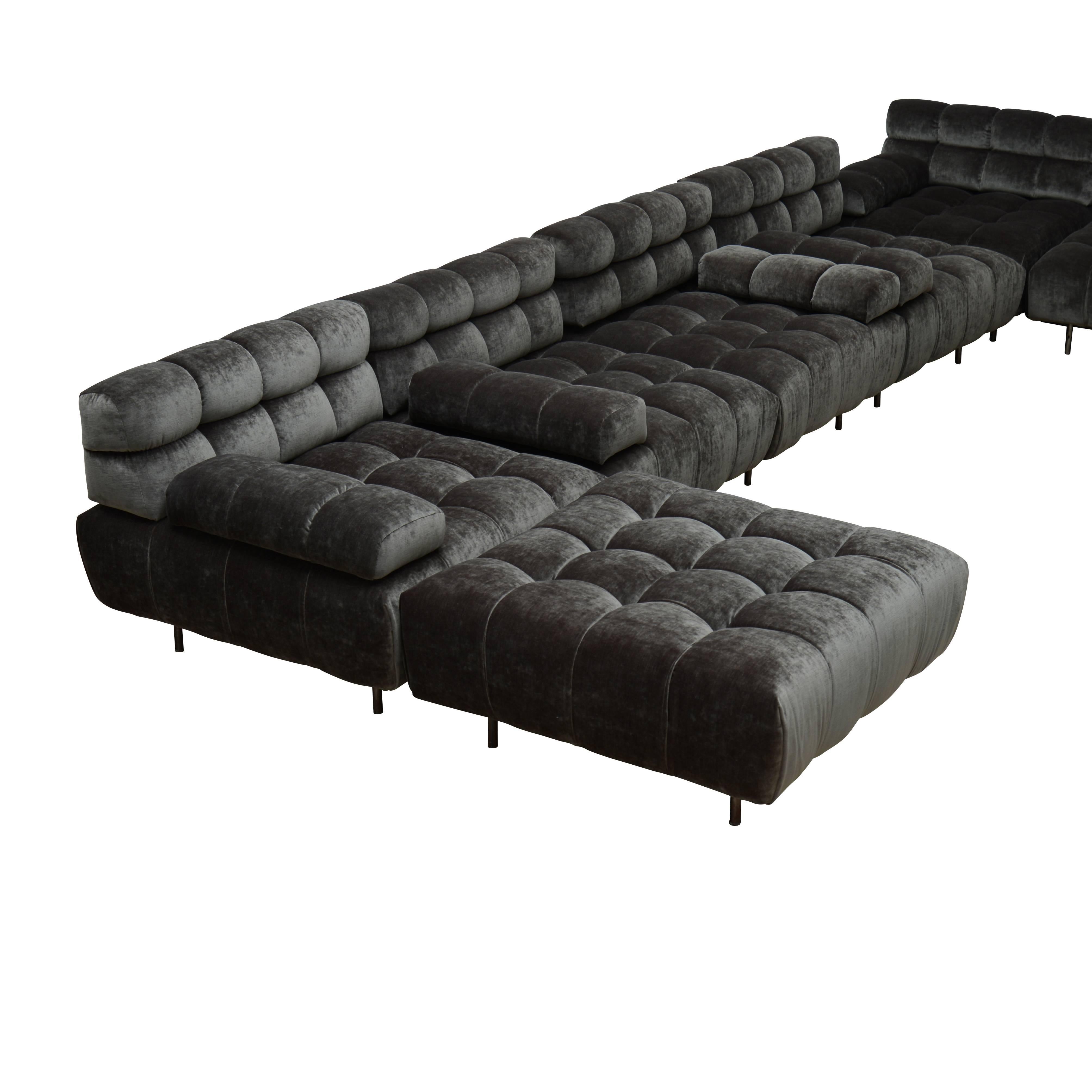Twelve section modular sofa upholstered in grey linen velvet. Seven arm, two armless, three ottoman.

Each section: 33" W x 33" D x 26" H, seat height 15", arm height 20".