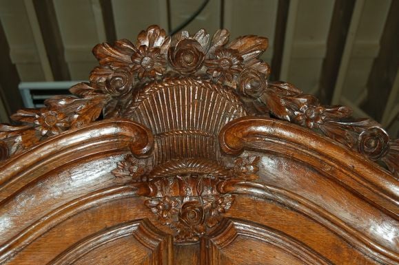 Early 18th century French oak bibliotheque with wedding bouquet (exquisite hand carving and original hardware). Originally $22,000 we are closing and having a liquidation sale
Dimension: 50'' W x 103'' H x 23'' D and top 12'' D.

Also: Bookcase,