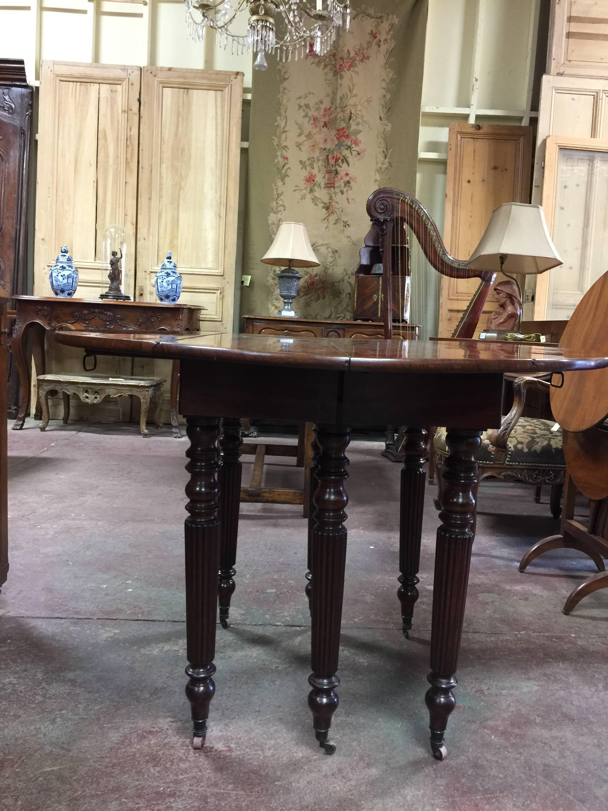 Mid-19th century French mahogany drop leaf extending dining table,
parlor table, center table.
EXTENDS TO 89''  ROOM FOR 46'' OF LEAVES
