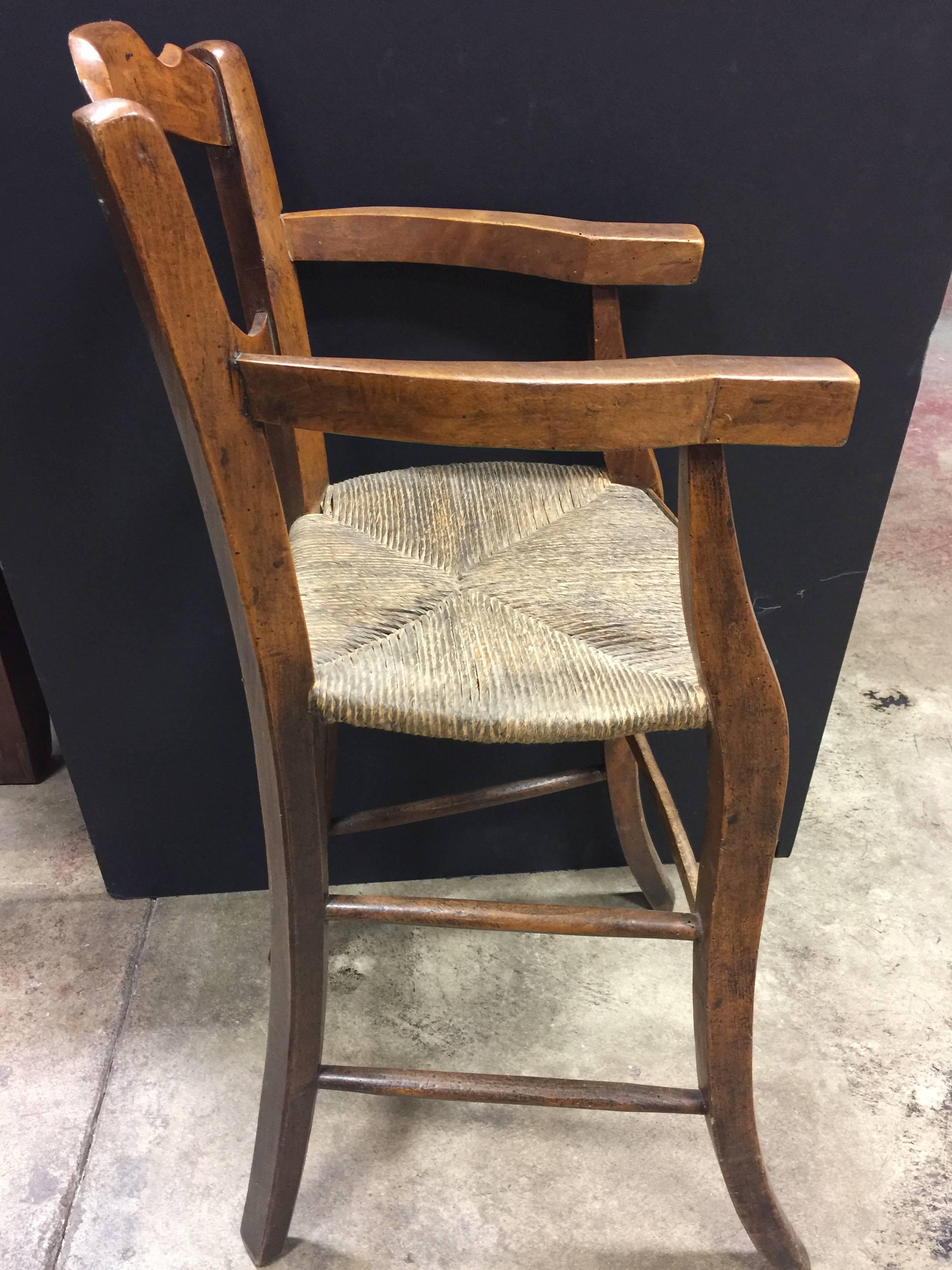 19th century French fruitwood child’s highchair.
Not original rush seat.
Childs chair.