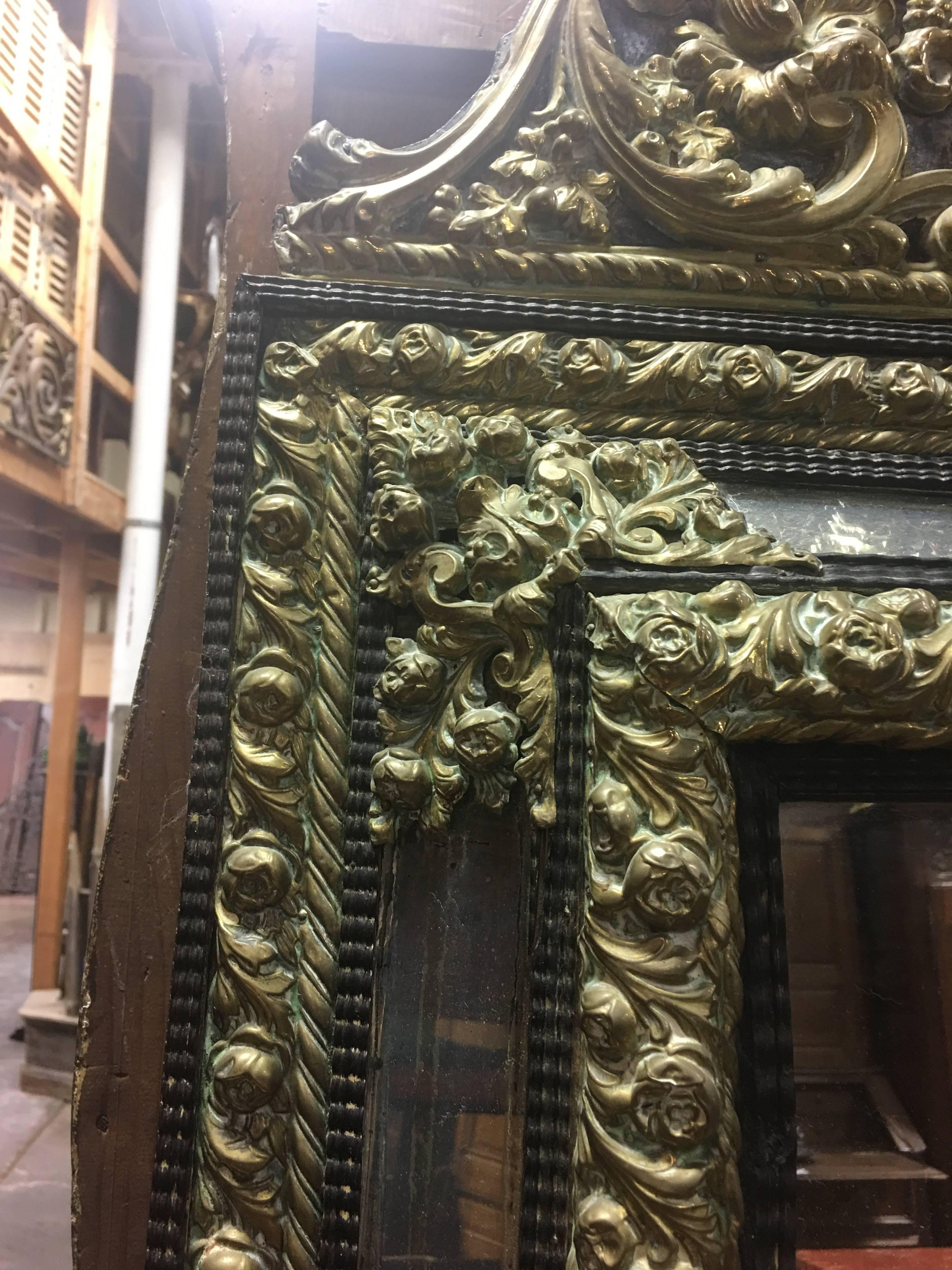 19th century French Louis XIV style ebony and gilded brass mirror.