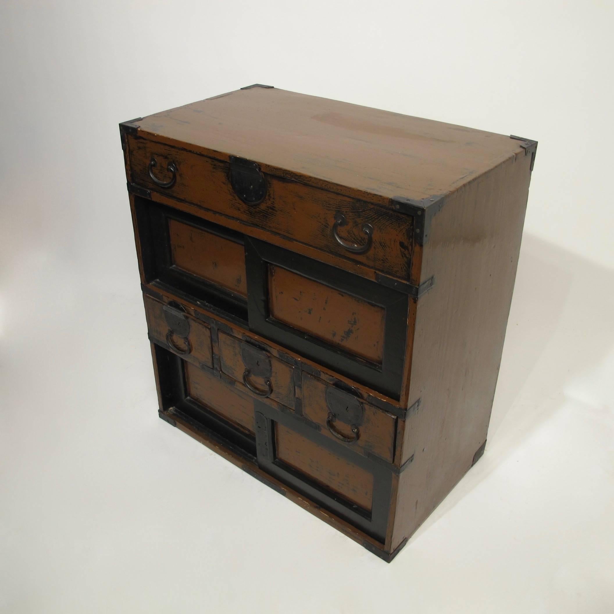 An unusual small size multi drawer tansu or chest with original iron hardware, Japan, late 19th-early 20th century.