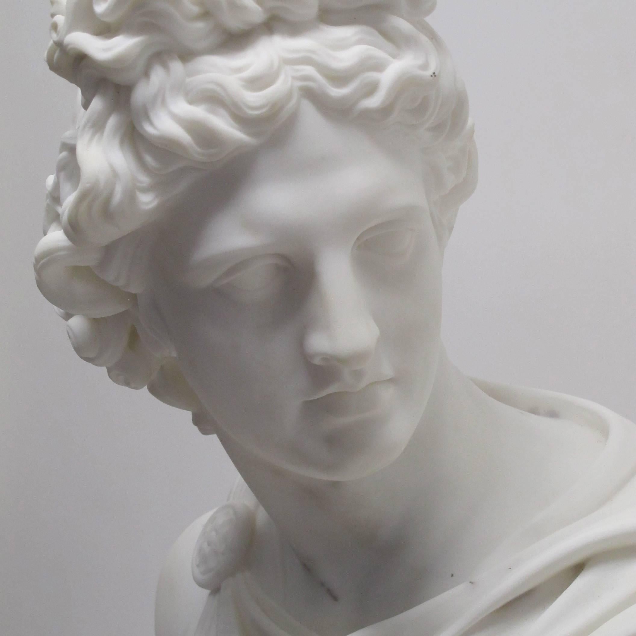 An impressive and larger than life size hand-carved Carrara marble bust of Apollo, signed C. Scheggi (1833-1876). Showing natural inclusions in the marble. Italy, 19th century.