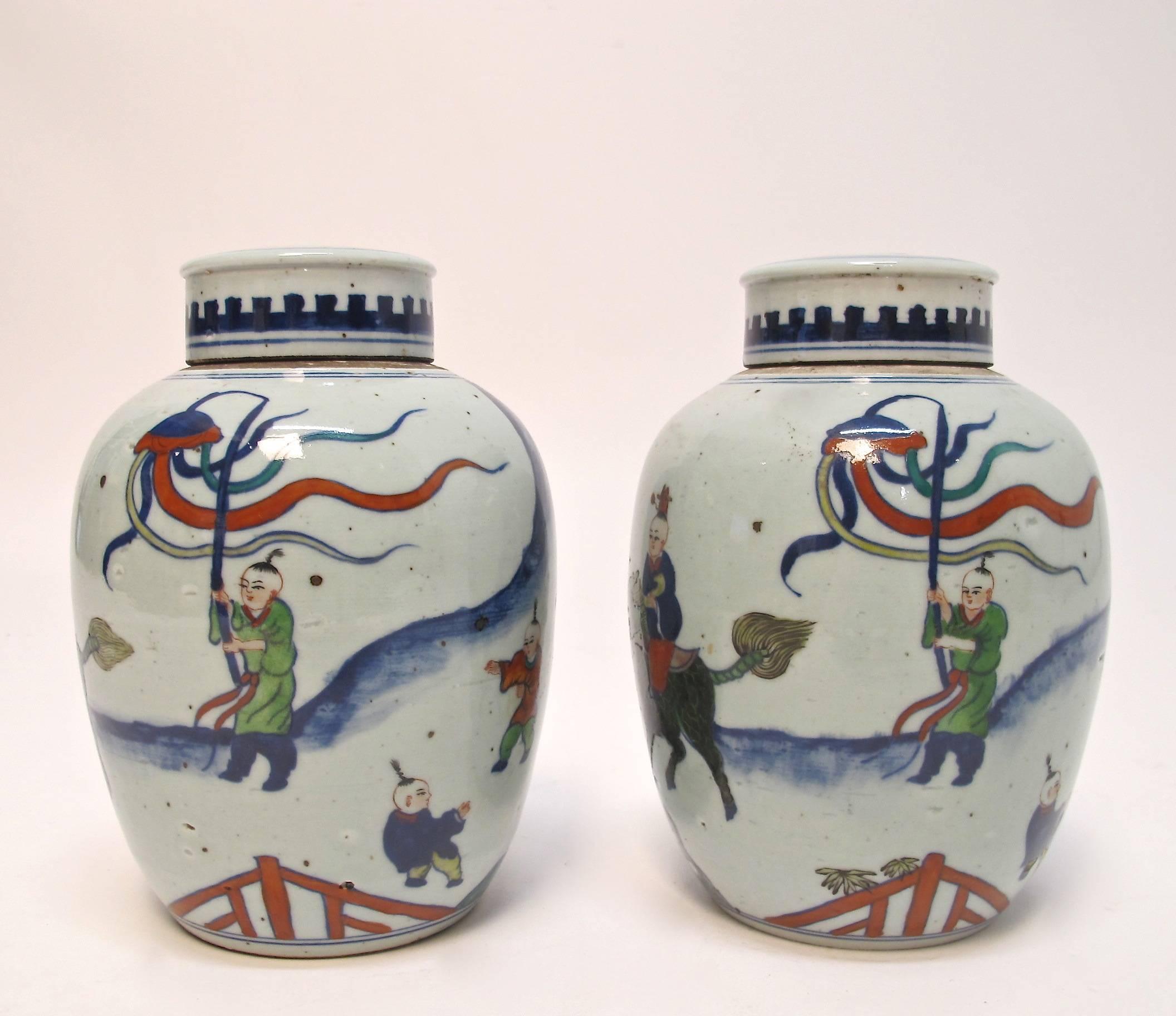 Mid size covered ginger jars with a colorful hand-painted ceremonial scene, China, late 19th century.