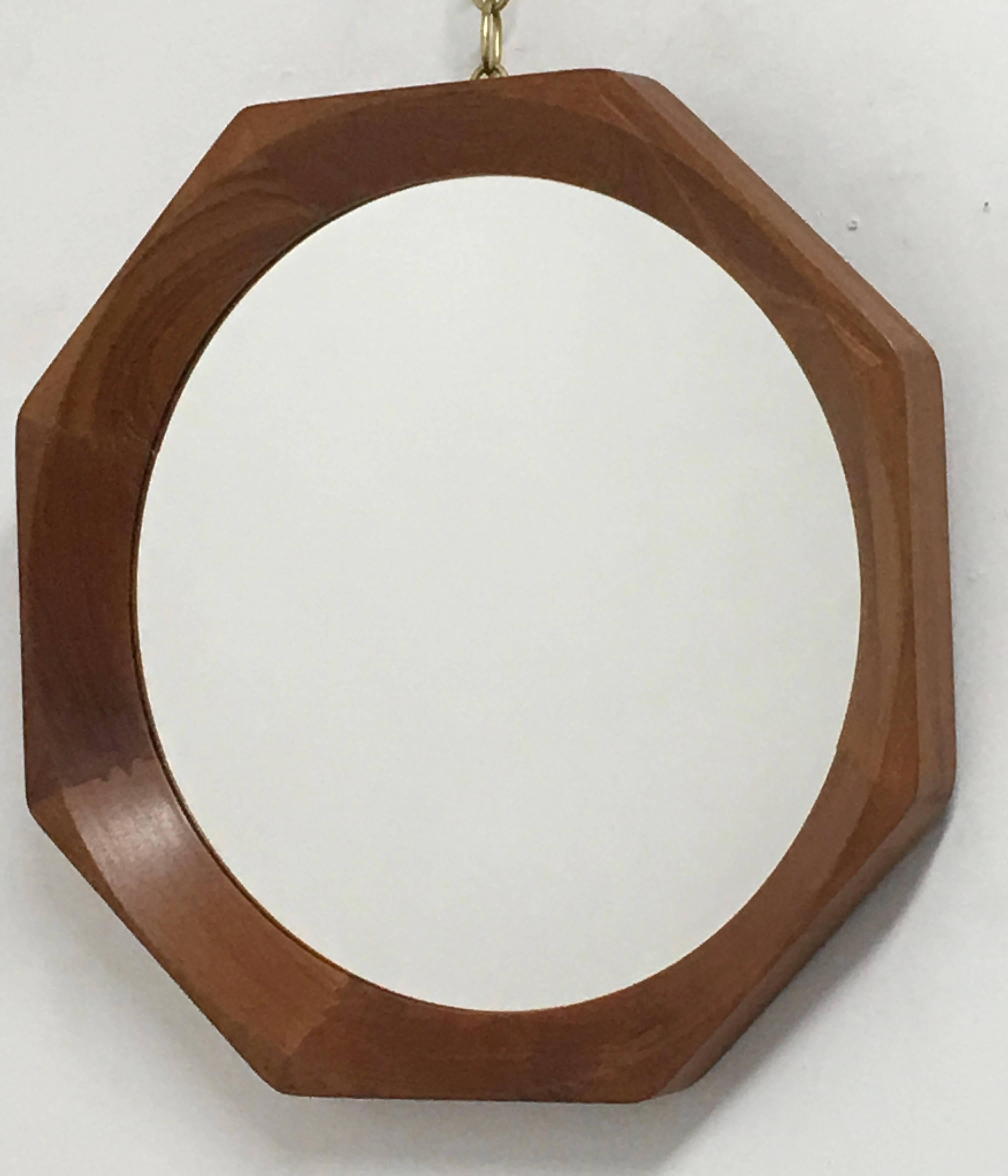 Octagonal Danish mirror constructed of beveled joined pieces of walnut. Sturdy mirror with a simple and elegant design. Back is marked 